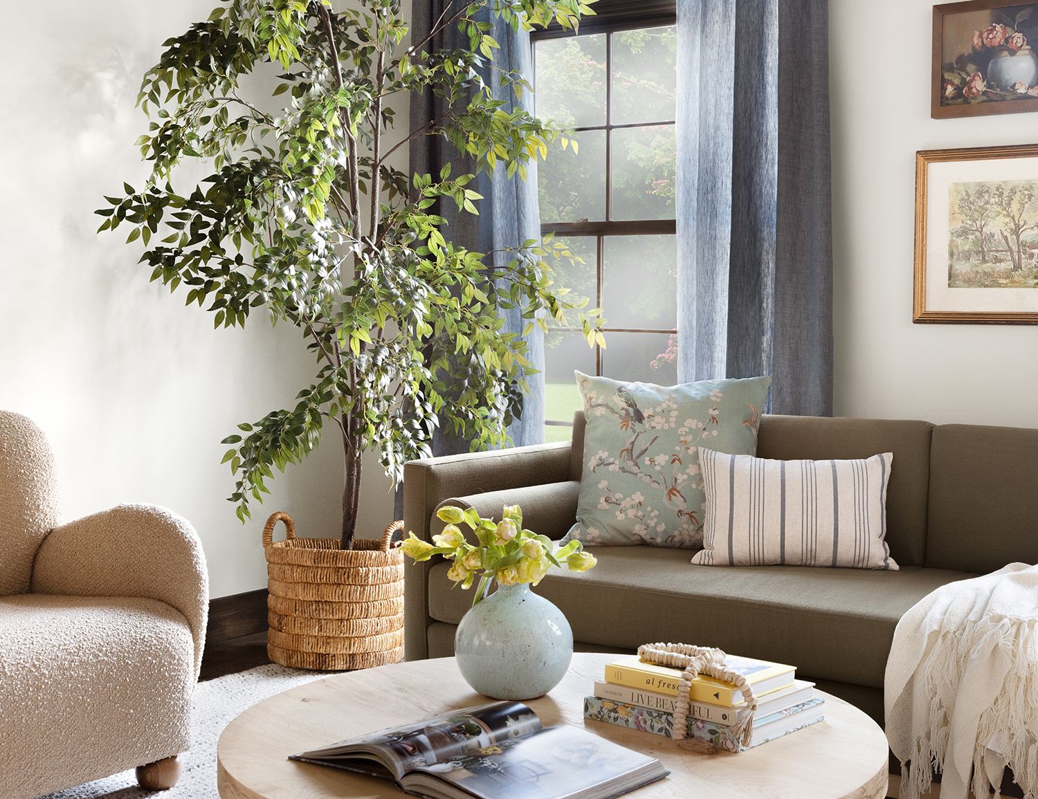 Serene coastal living room with soft neutrals, cascading greenery, and natural wood accents