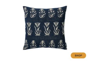Navy pillow with geometric botanical stems in cream embroidered pattern