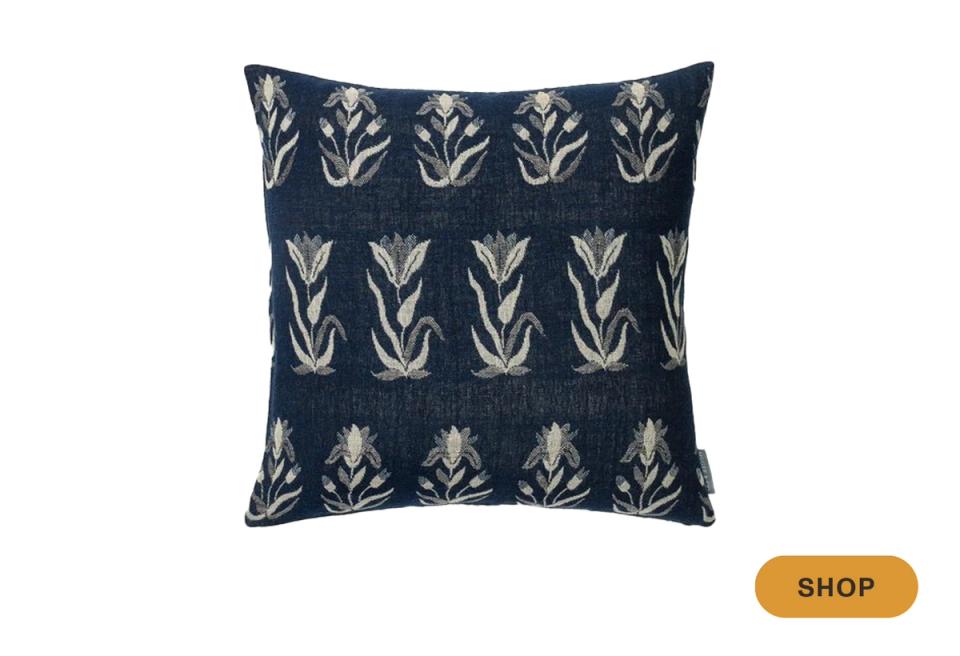 Navy pillow with geometric botanical stems in cream embroidered pattern