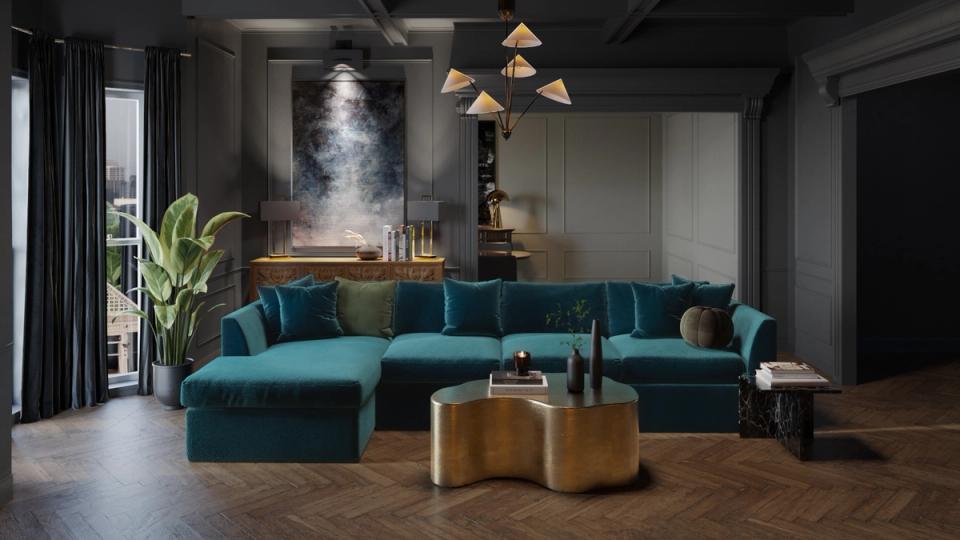 Contemporary living room with teal velvet sectional, brass accents, dark moody walls, and geometric pendant lighting