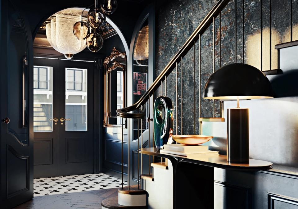 Industrial entryway with black exposed brick, brass pendant lighting, and monochromatic color scheme