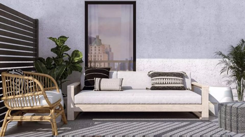 Contemporary terrace with rattan seating, neutral tones, and urban artwork