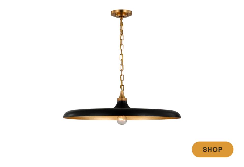 Mid-century modern brass and black pendant with geometric form and warm metallic finish