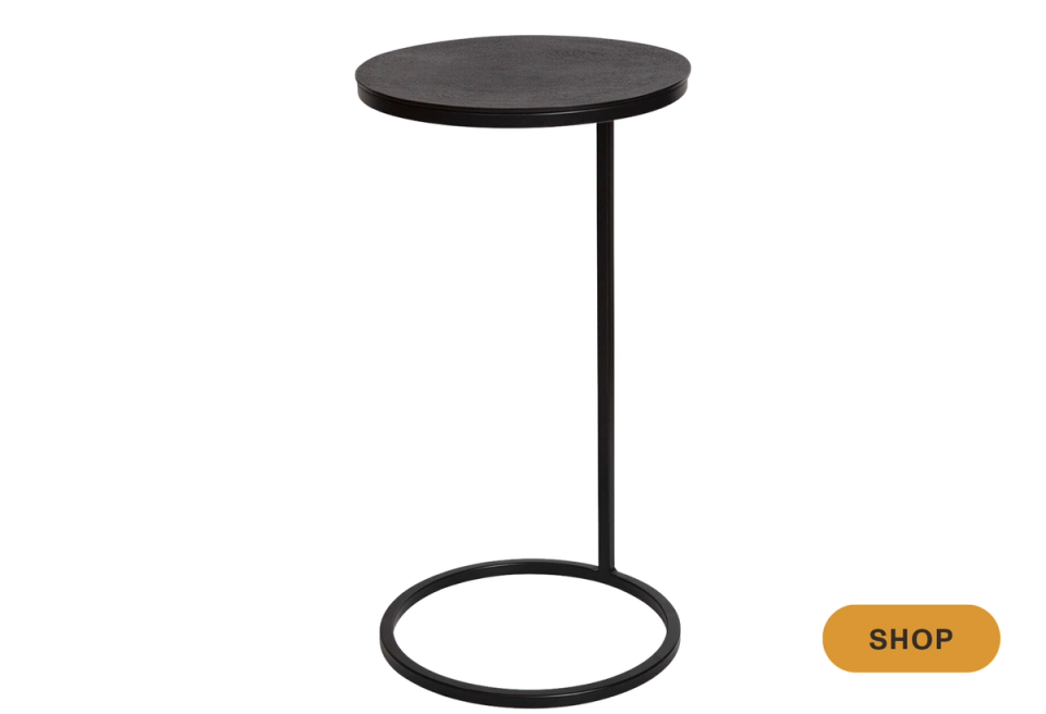 Industrial-modern black martini table with minimalist circular base and clean lines