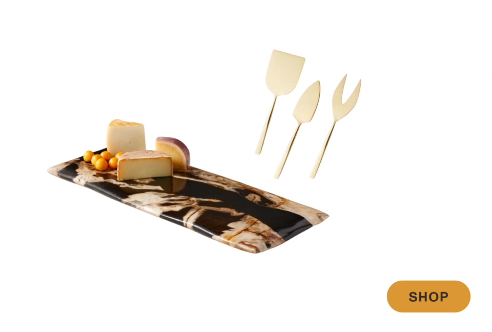 Luxe tortoiseshell catchall tray with gold serving utensils, embodying warm, eclectic maximalist styling with rich amber and cream tones.