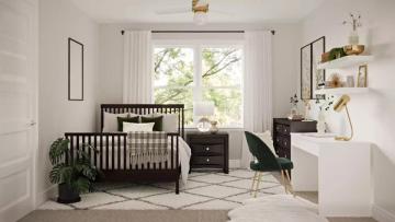 Scandinavian nursery with dark wood crib, geometric rug, soft natural light