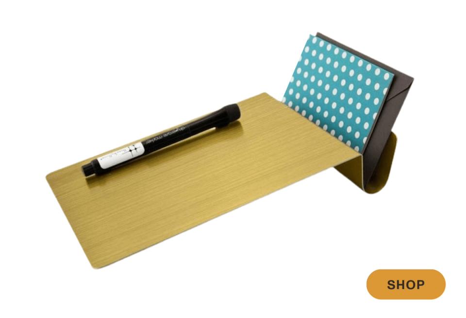 Mustard yellow desk pad with teal patterned memo holder, playful modern styling