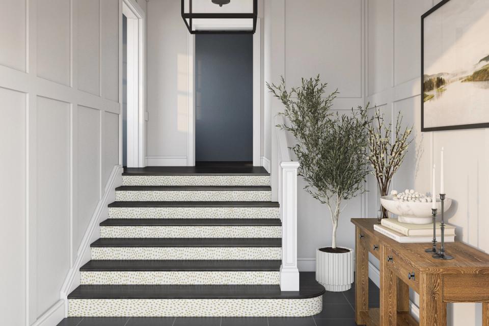 Bold teal paneled wall treatment creates modern living room with warm wood credenza and geometric rug