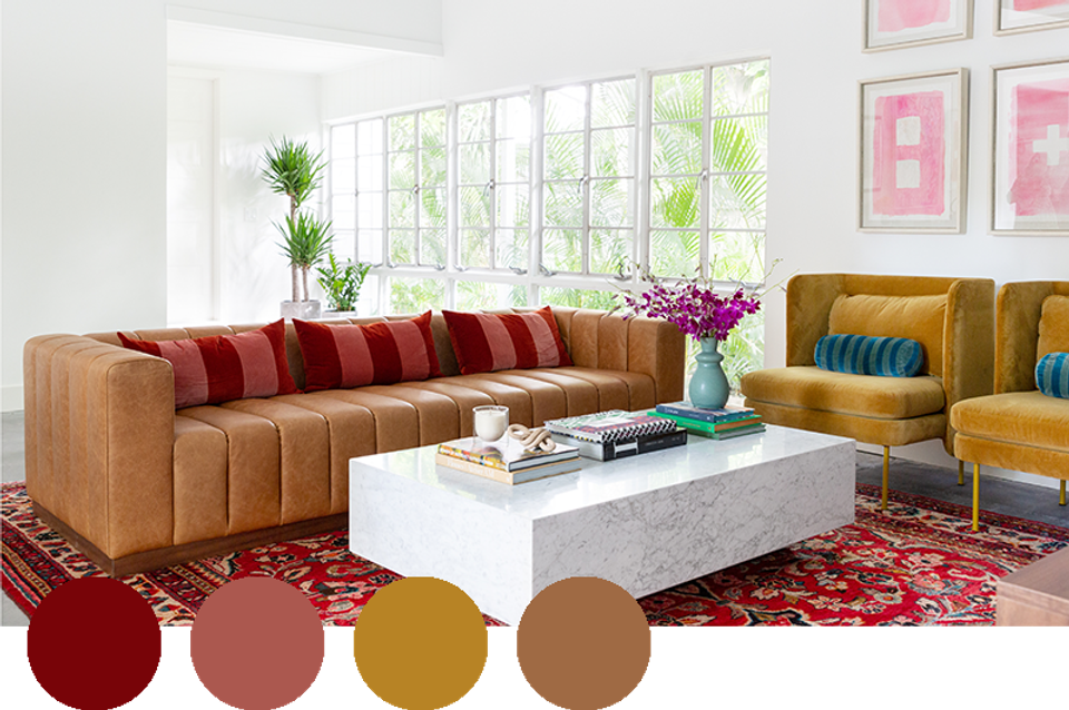 Contemporary space blending cognac leather, golden mustard, and deep red for rich warmth.
