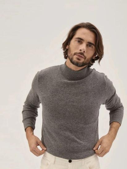 A fine-knit, high-necked jumper can do it all