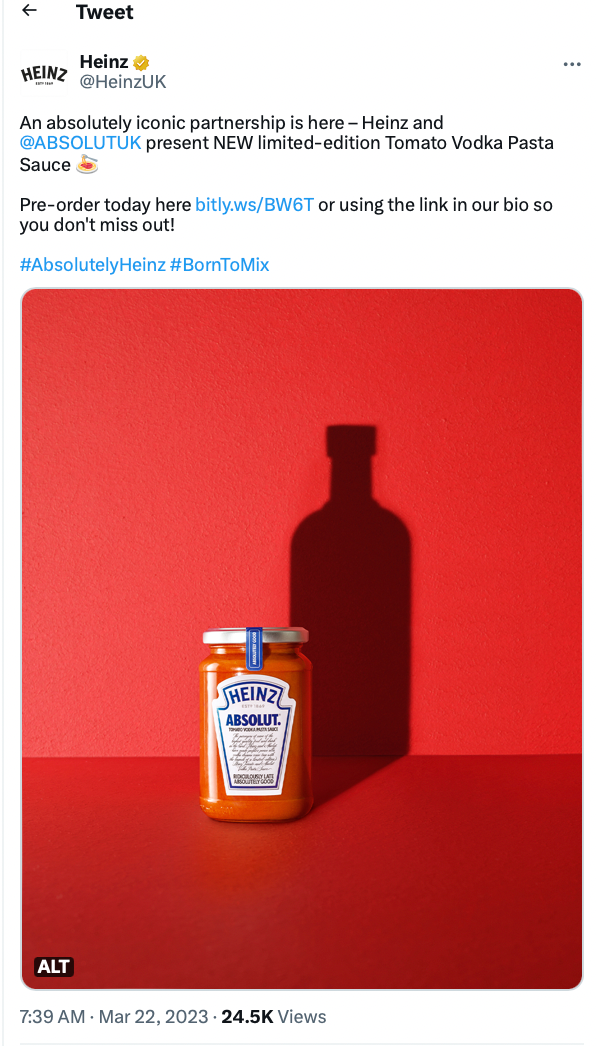 A tweet from the Heinz UK account showing the campaign creative featuring a bright red background and vodka bottle silhouette.