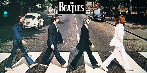 Cover art from the Beatles iconic Abby Road album. It shows the band members strutting across a crosswalk.