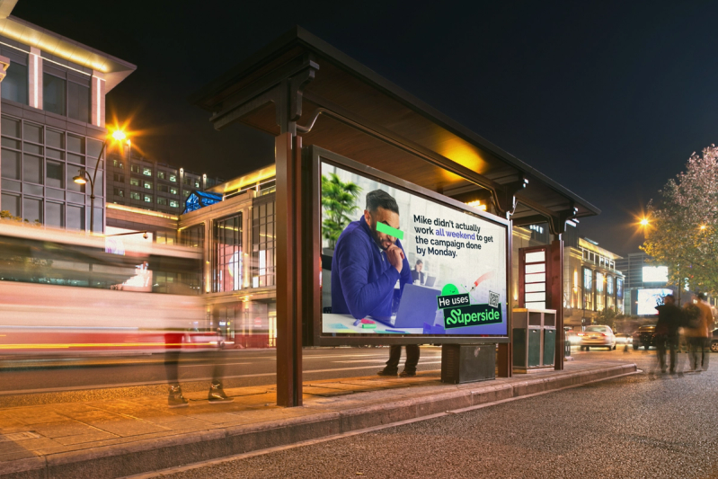 A time-lapse image of a Superside billboard on a busy street.