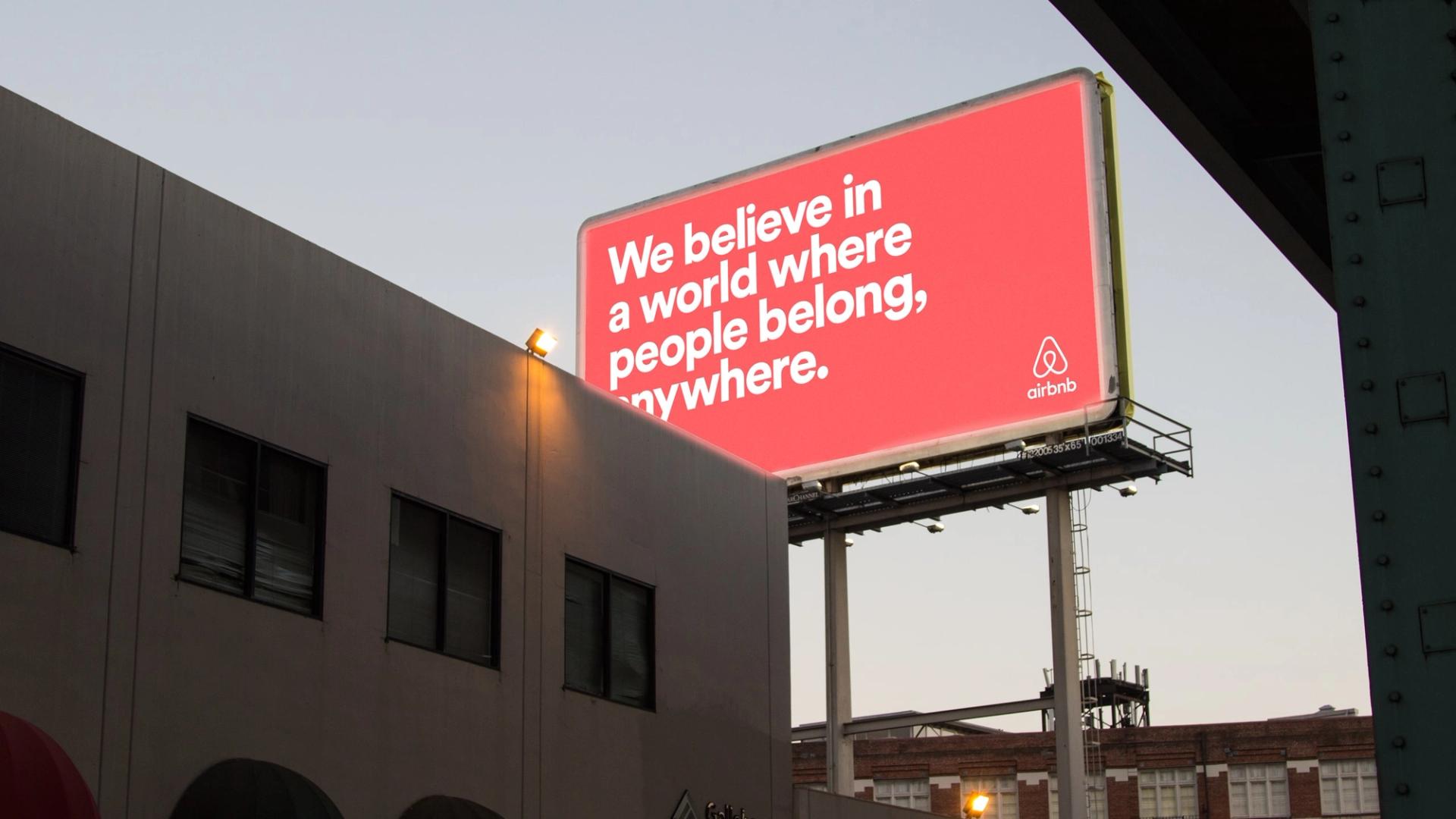 An Airbnb billboard that reads, “We believe in a world where people belong, anywhere.”