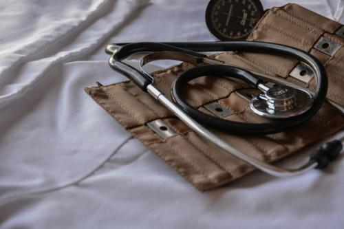 An image of a stethoscope and brown carrying case