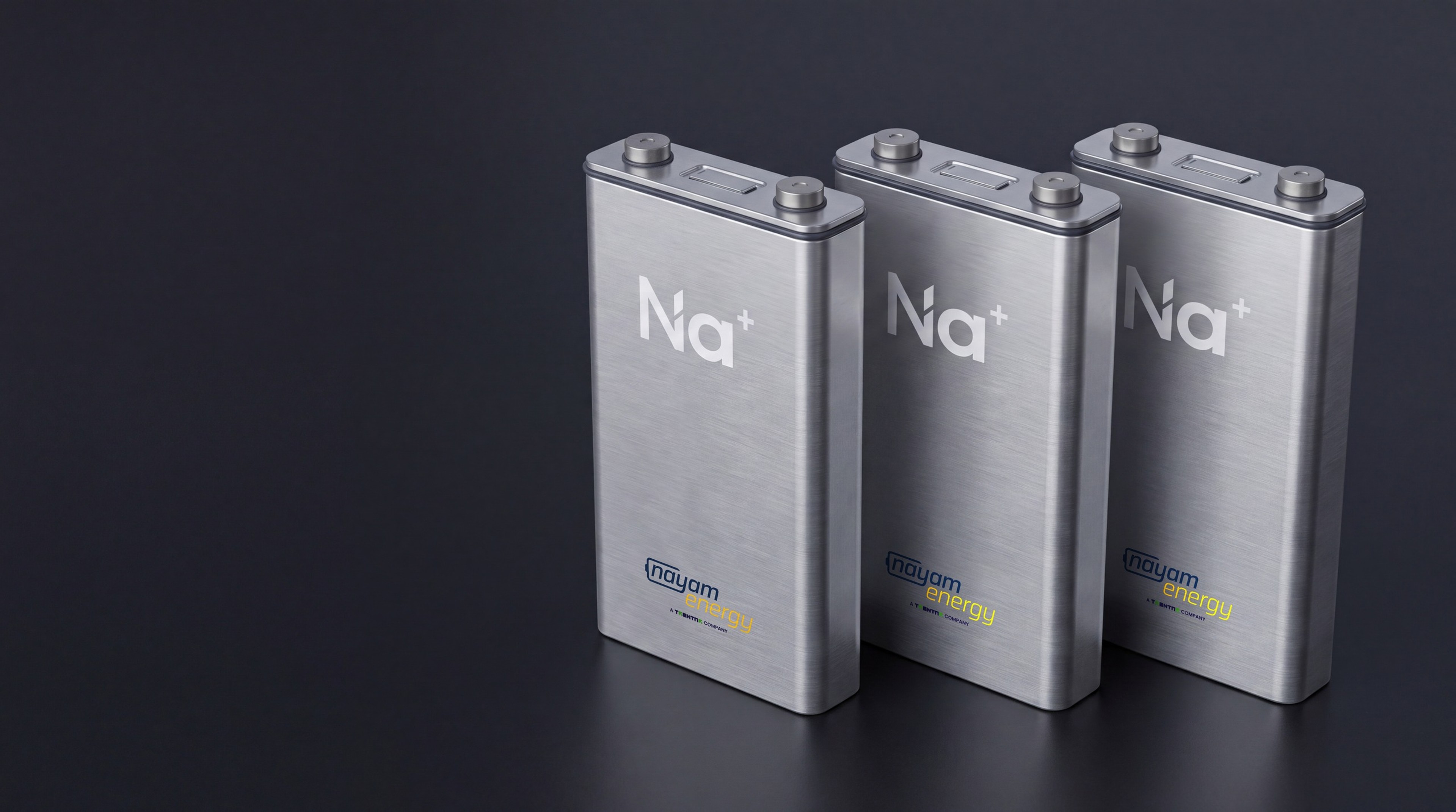 Three prismatic Nayam sodium-ion cells with Na+ marking and Nayam Energy branding, product view
