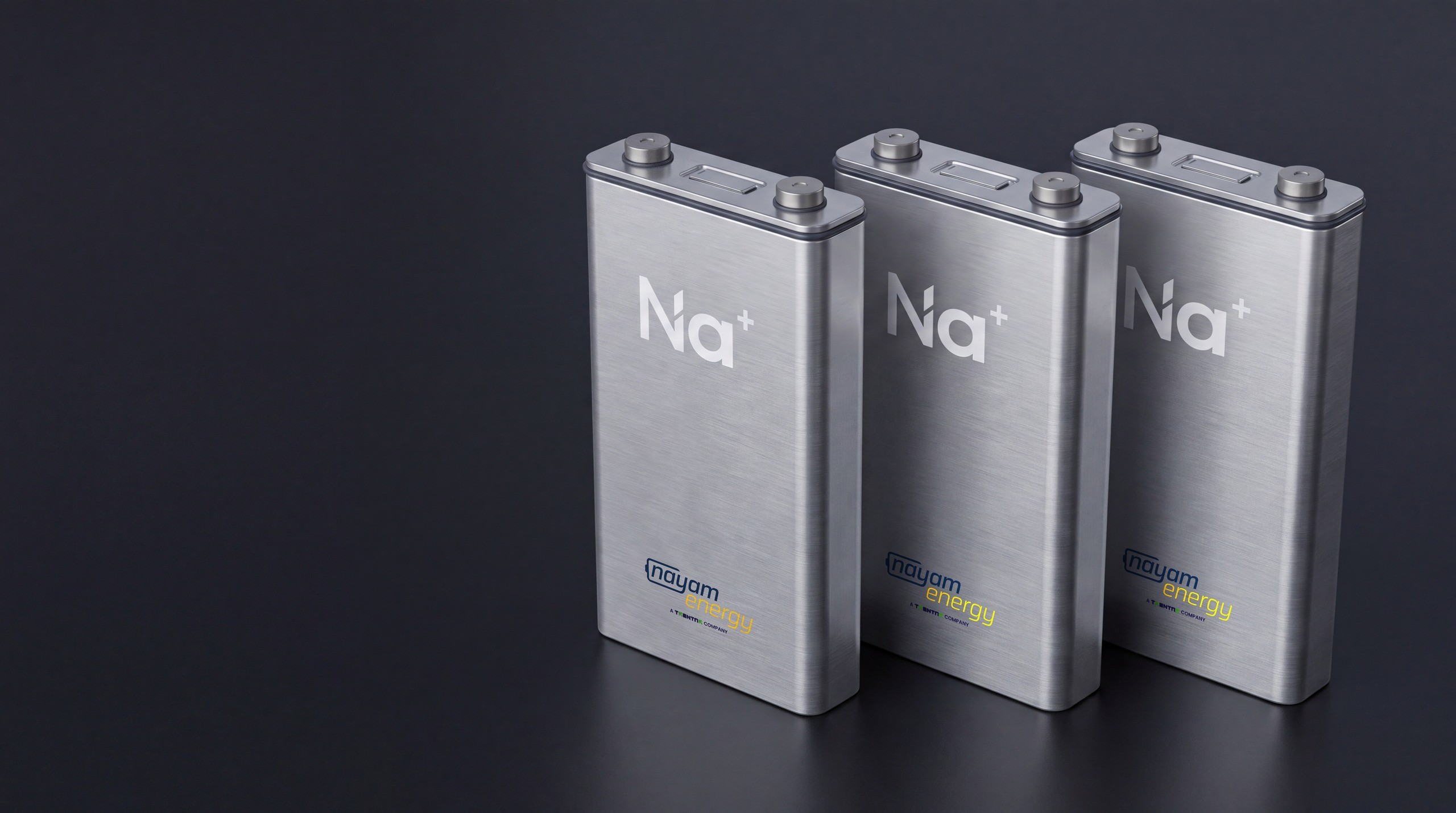 Three prismatic Nayam sodium-ion cells with Na+ marking and Nayam Energy branding, product view