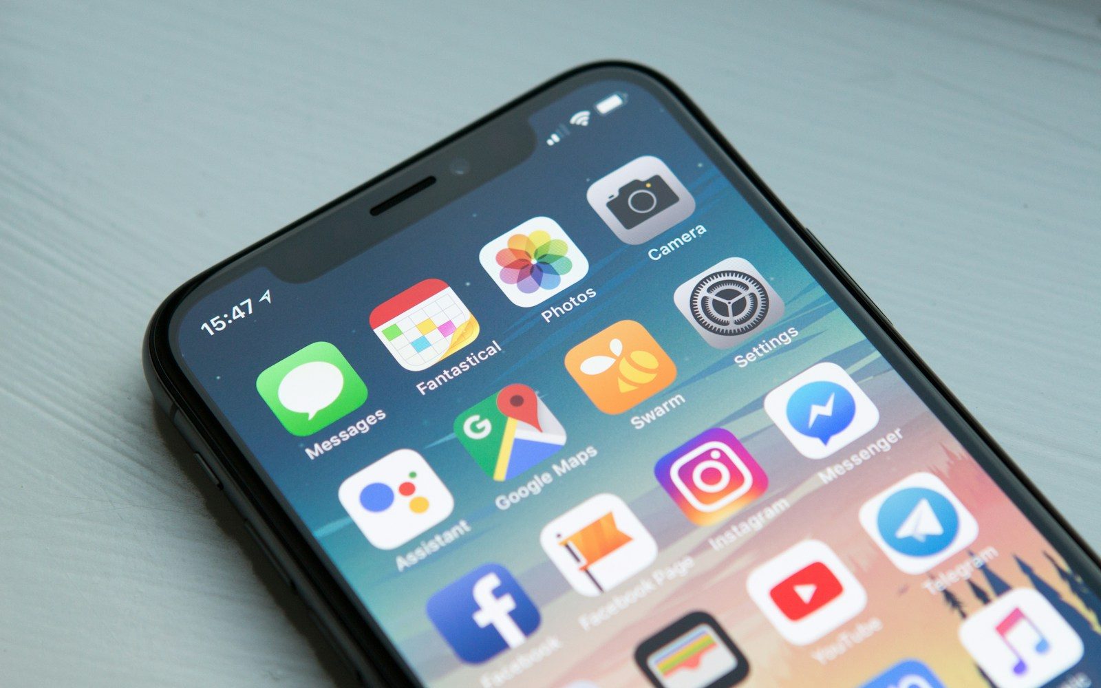 Smartphone home screen showing a collection of mobile applications