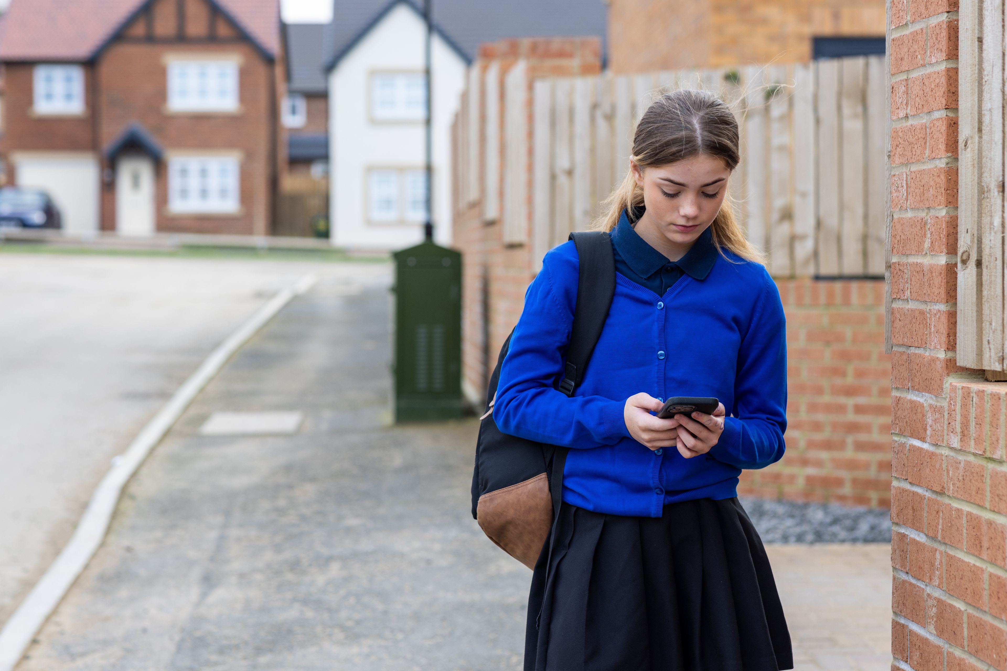 A school girl walking down the street