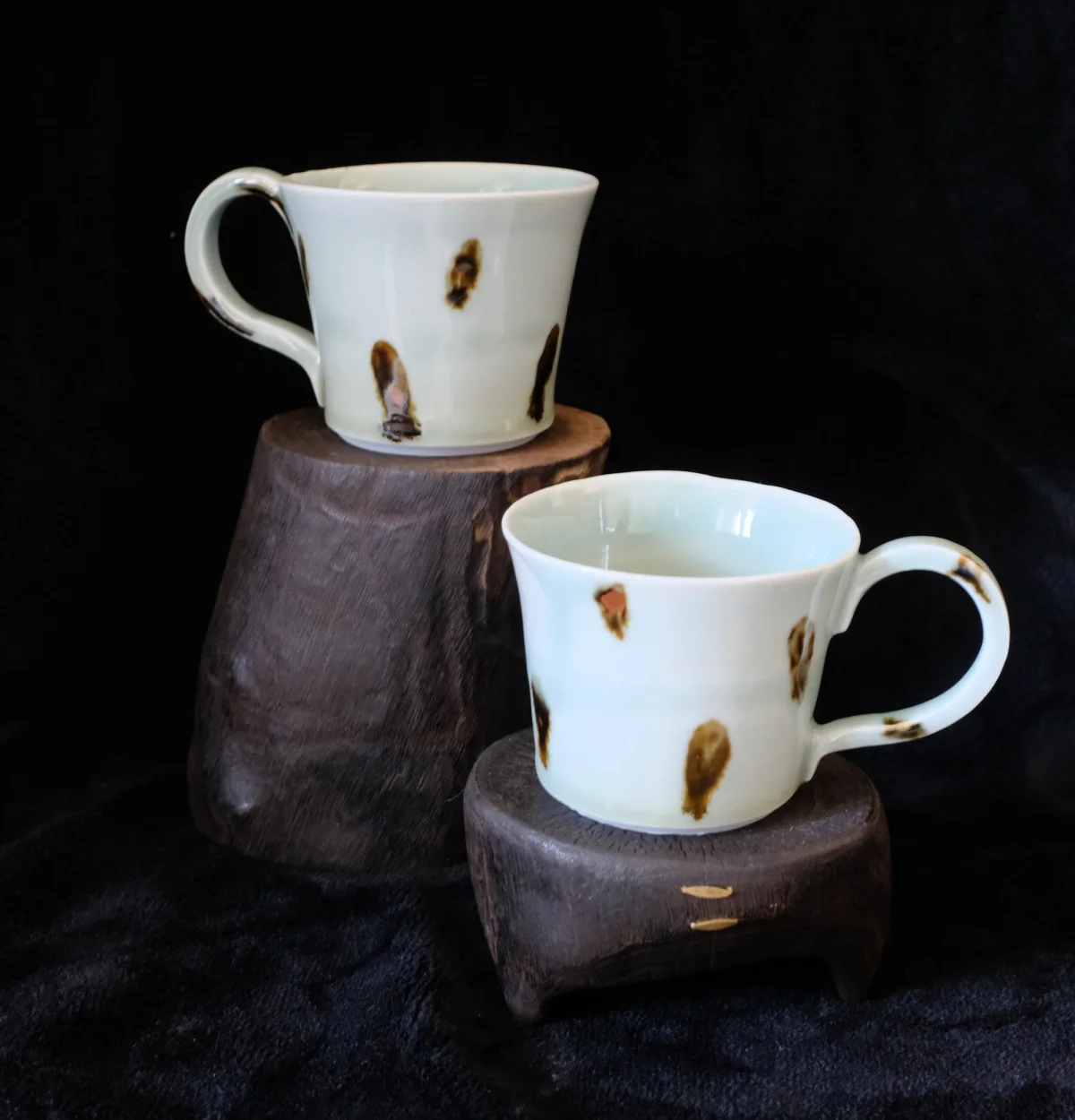 Porcelain celadon mugs with oxides