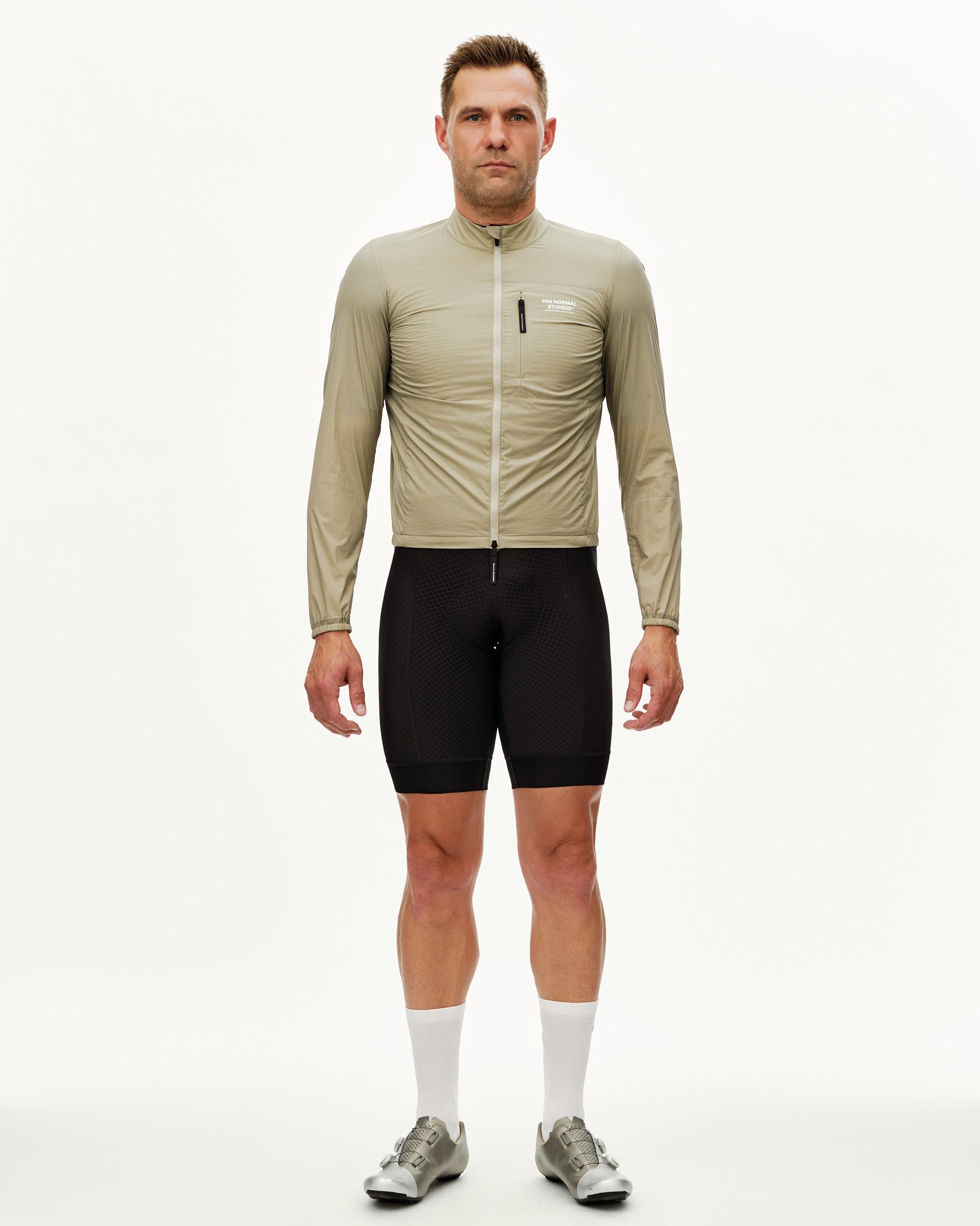 Grey Sage Essential Insulated cycling jacket on model, front view with full zip and chest pocket