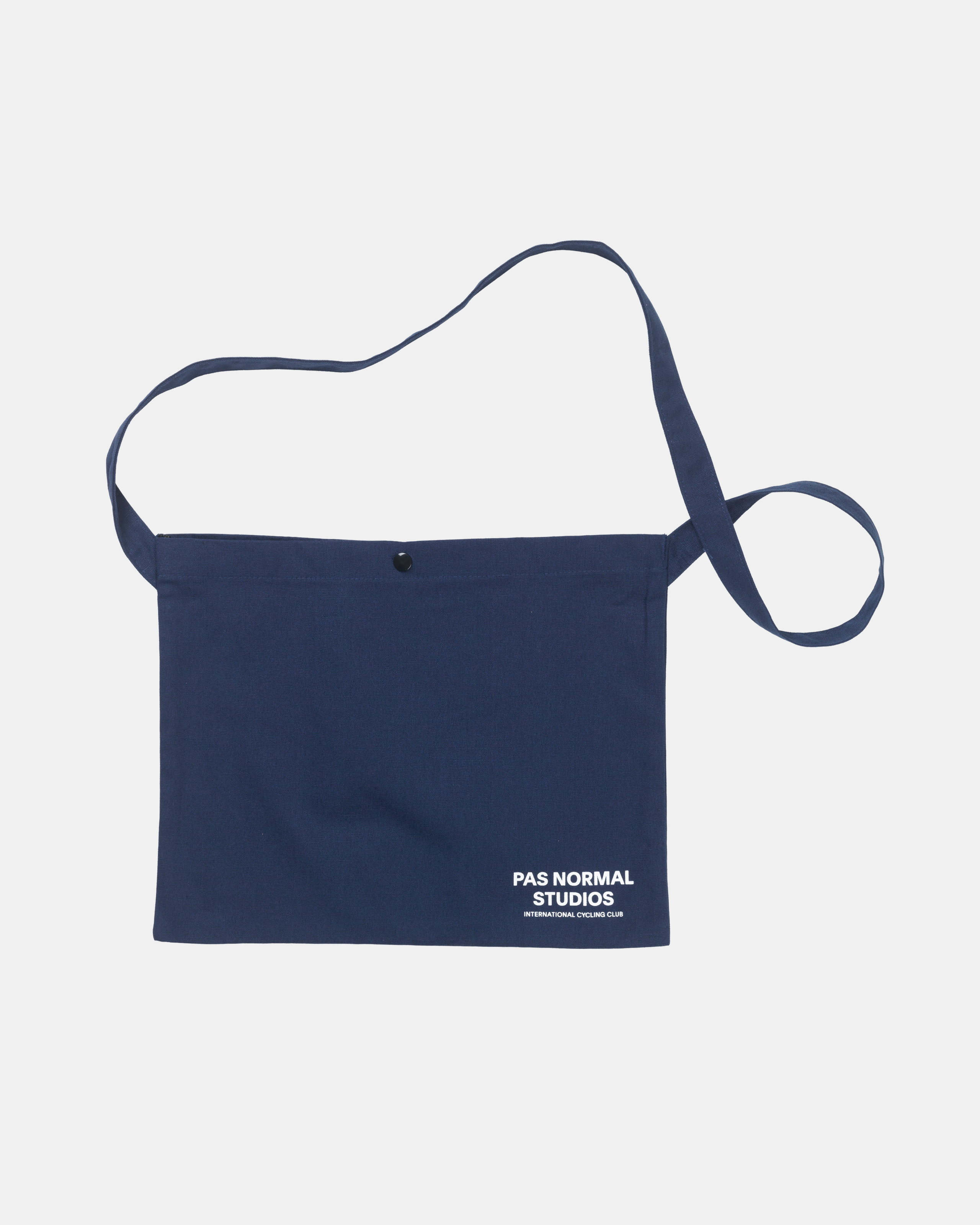 Navy Off-Race musette bag, front flat lay with snap closure and white logo print