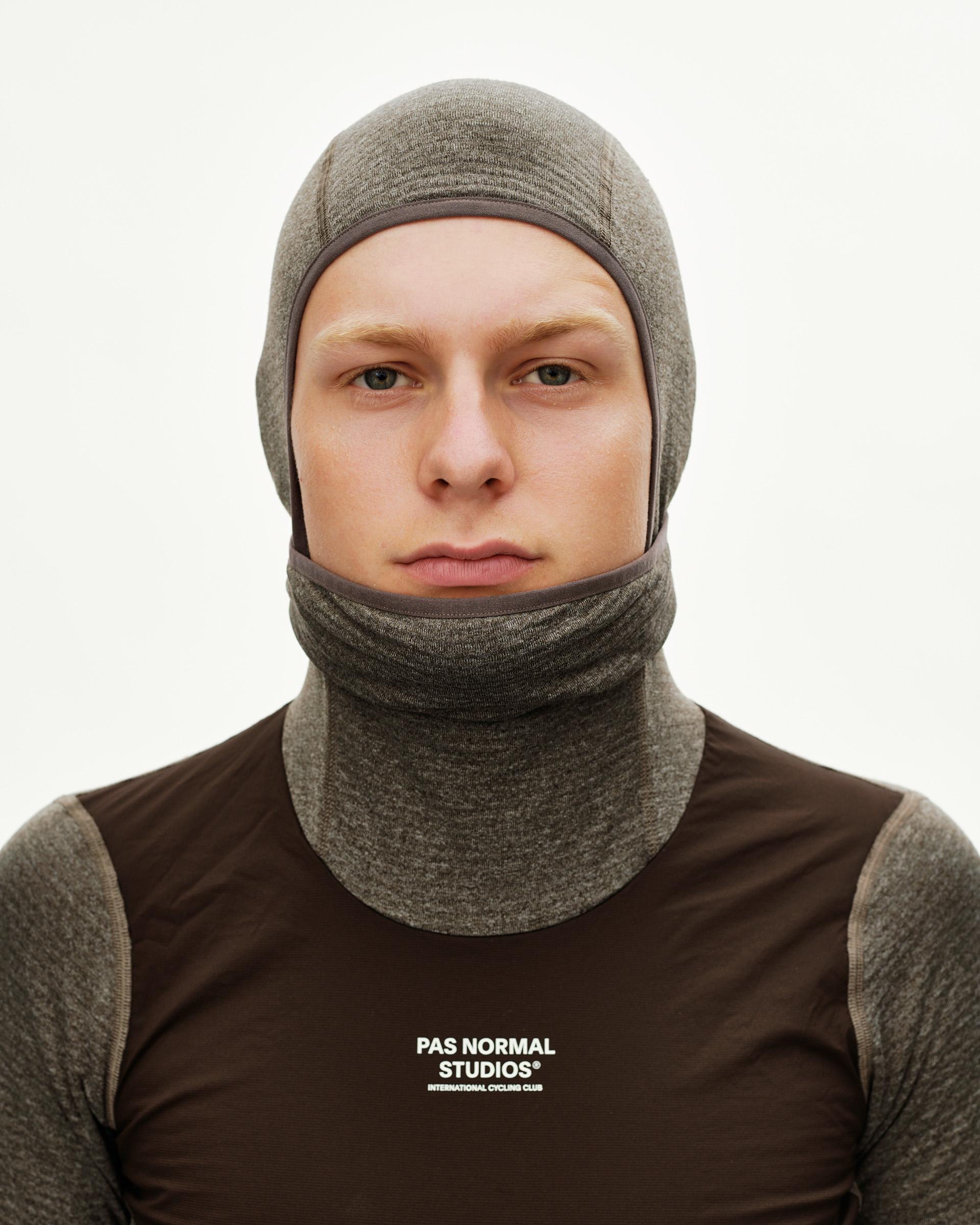 Dark Coffee brown Essential cycling balaclava on model, front view with contrast trim binding