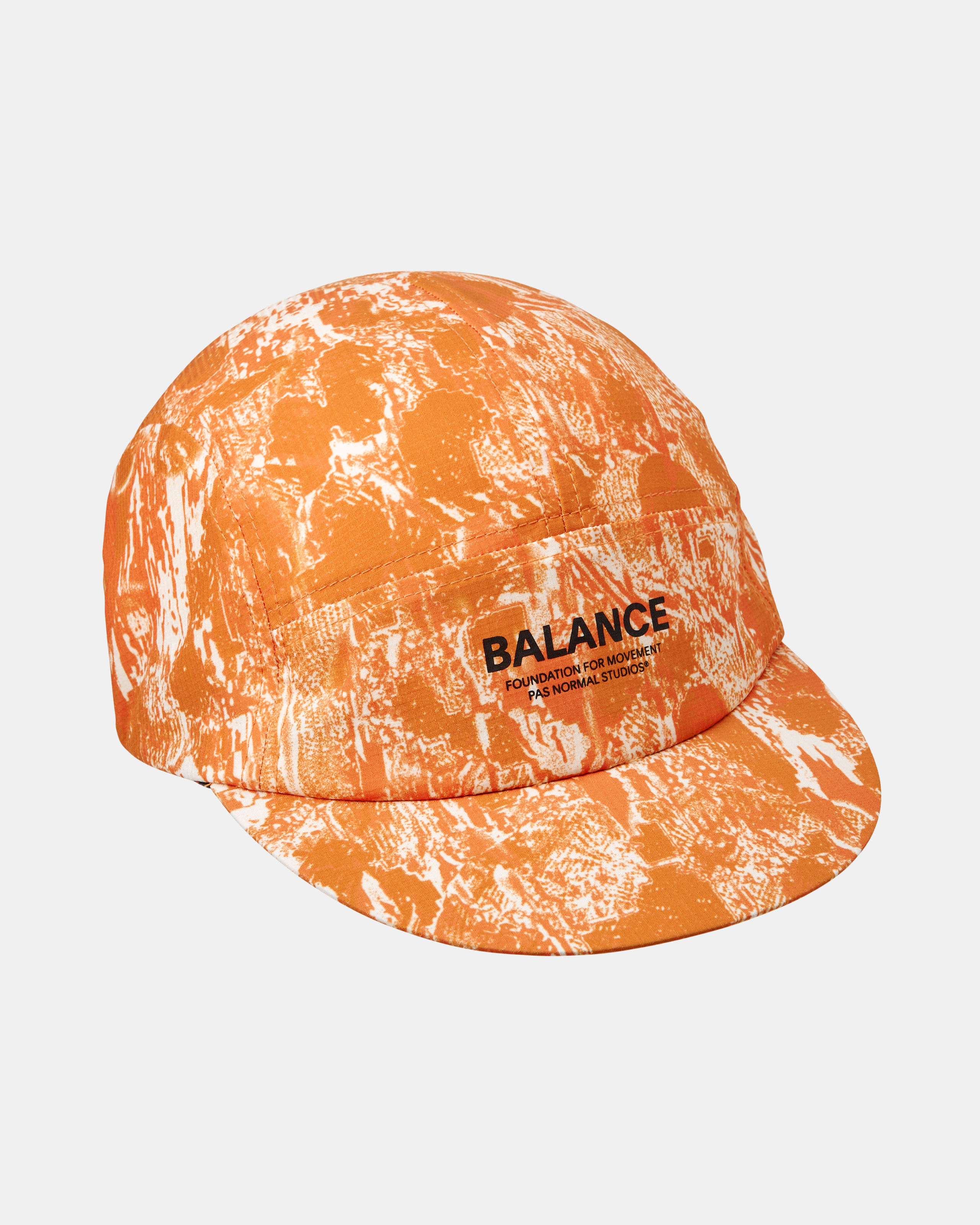 Orange Balance cap, three-quarter flat lay with all-over white abstract print and front logo patch