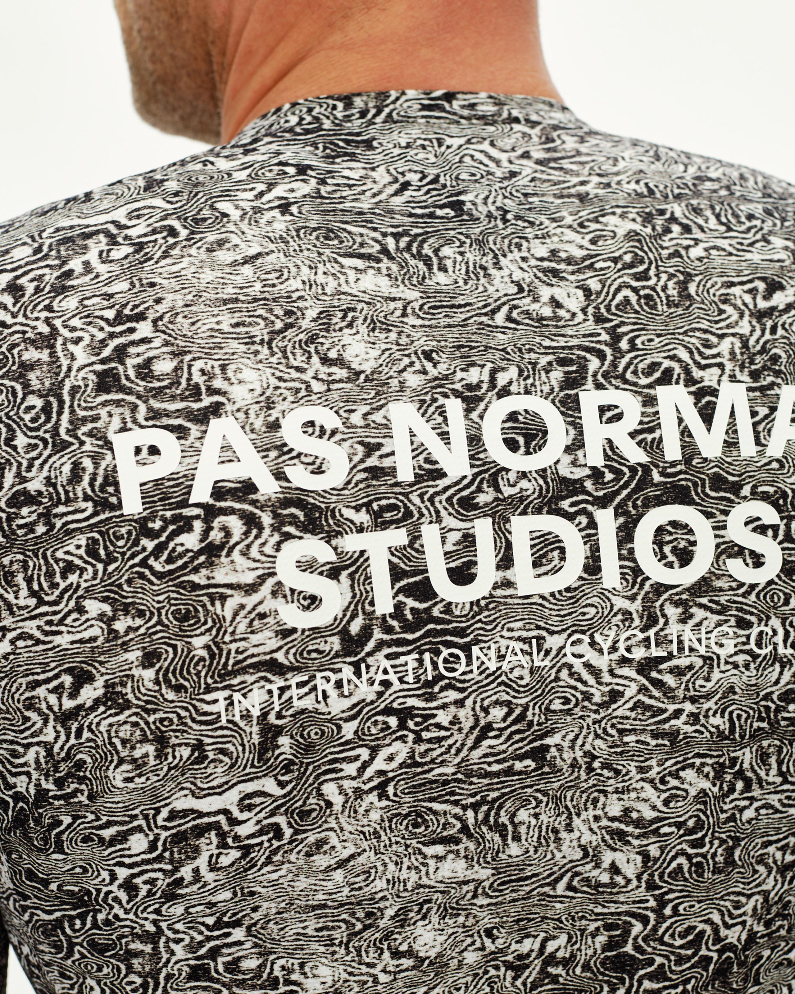 Off White Essential cycling jersey, rear detail on model with all-over grain print and large back logo