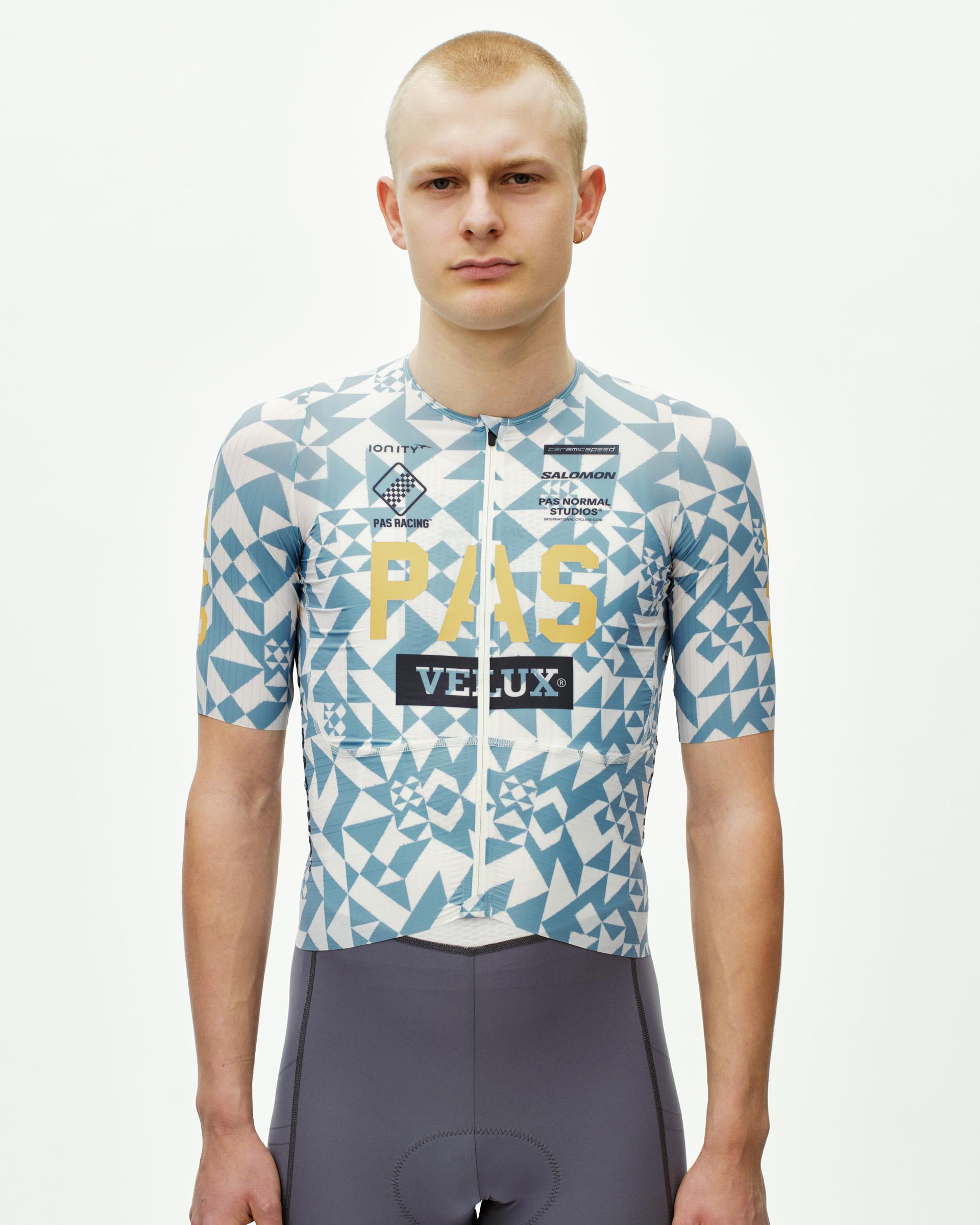 Origami Light Blue PAS Mechanism Pro cycling jersey on model, front view with geometric print and team sponsor logos