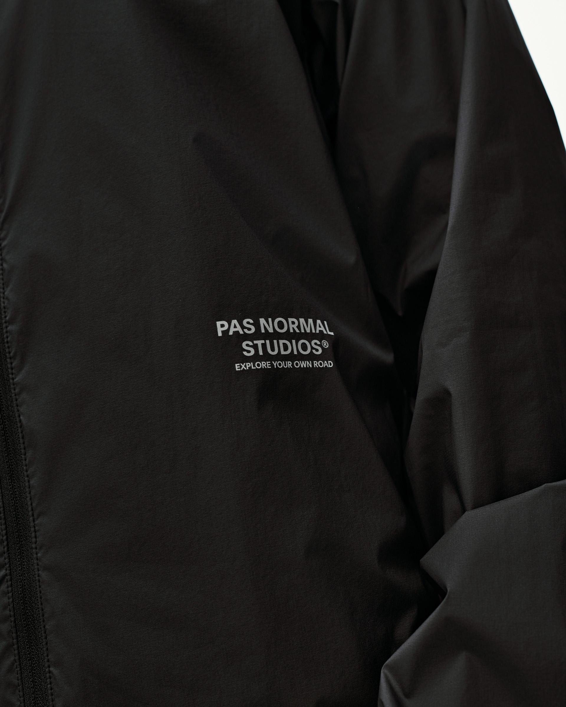 Black Balance Windproof jacket, front detail view with chest logo print