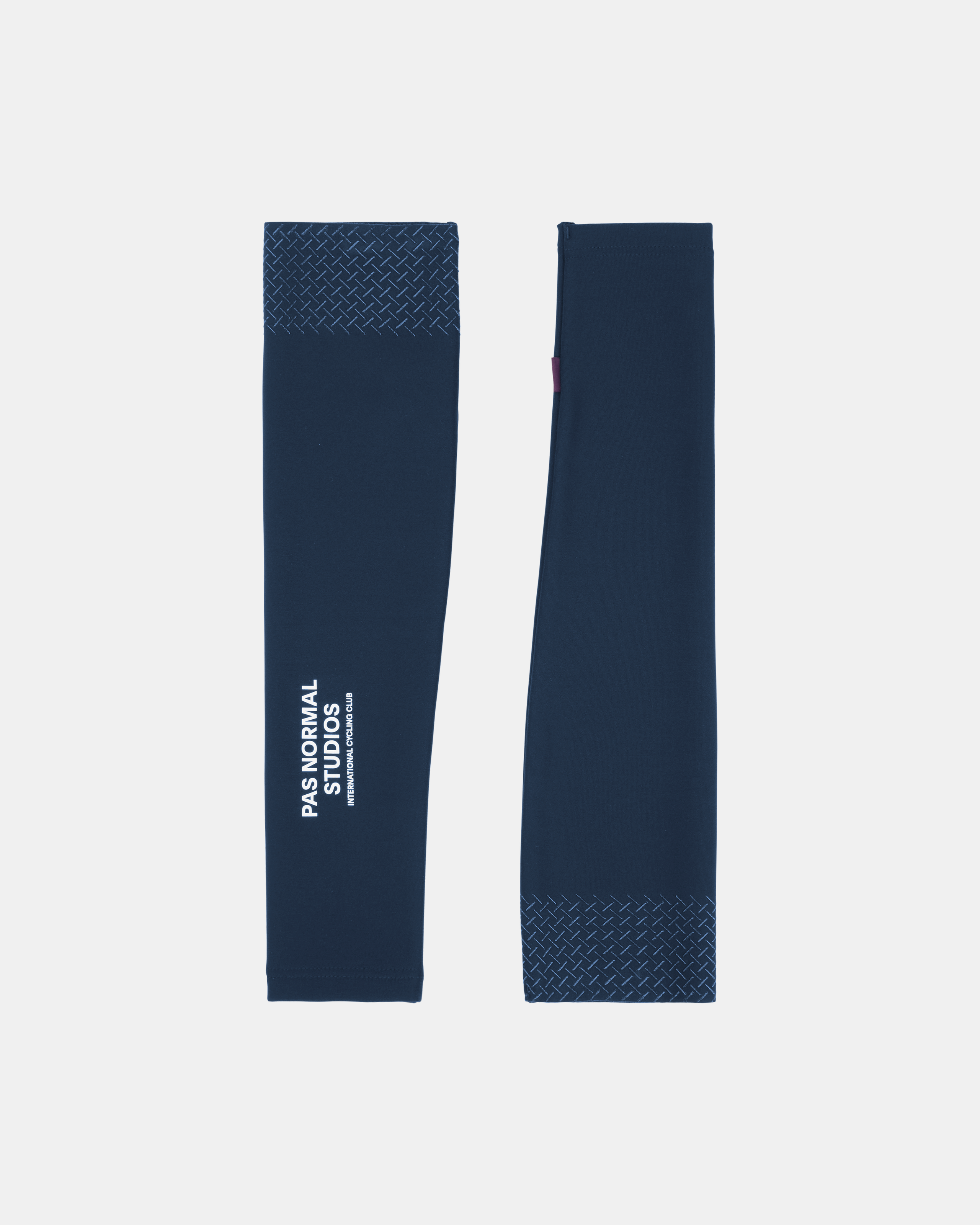 Navy Logo arm warmers pair flat lay with textured cuffs and white logo print