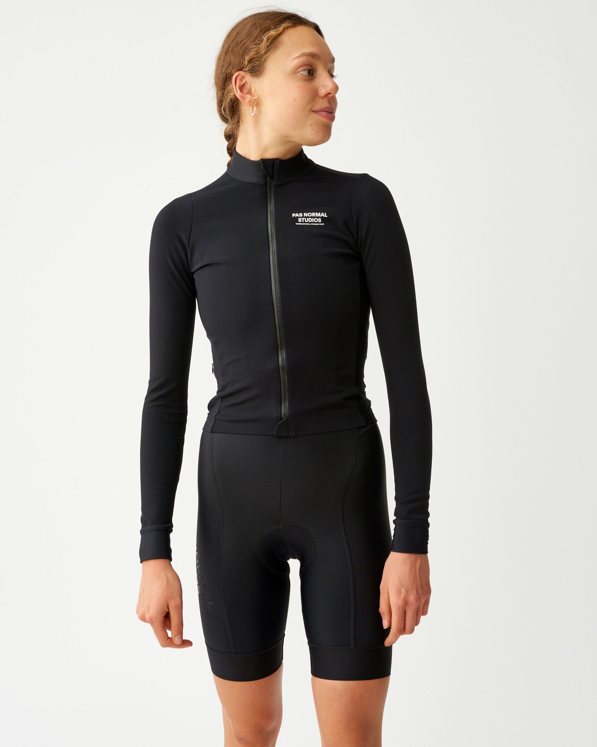 Black Mechanism long sleeve cycling jersey on model with front zip and white chest logo