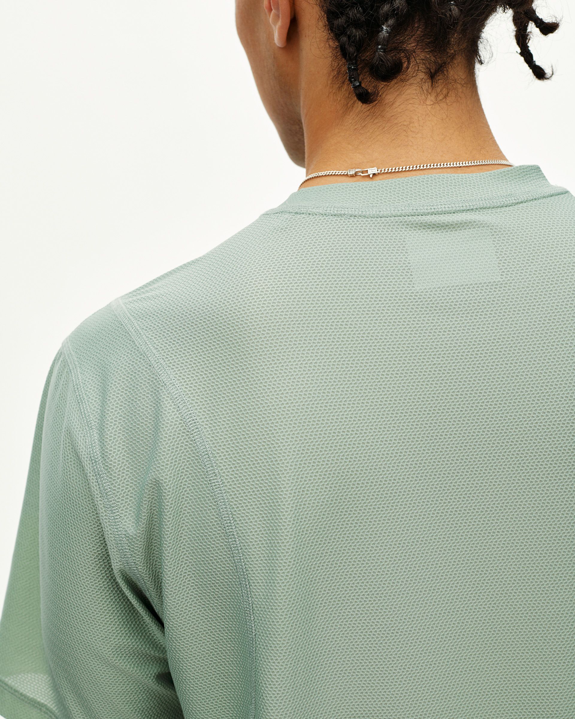 Green Sage Balance T-Shirt, rear detail on model with textured mesh fabric