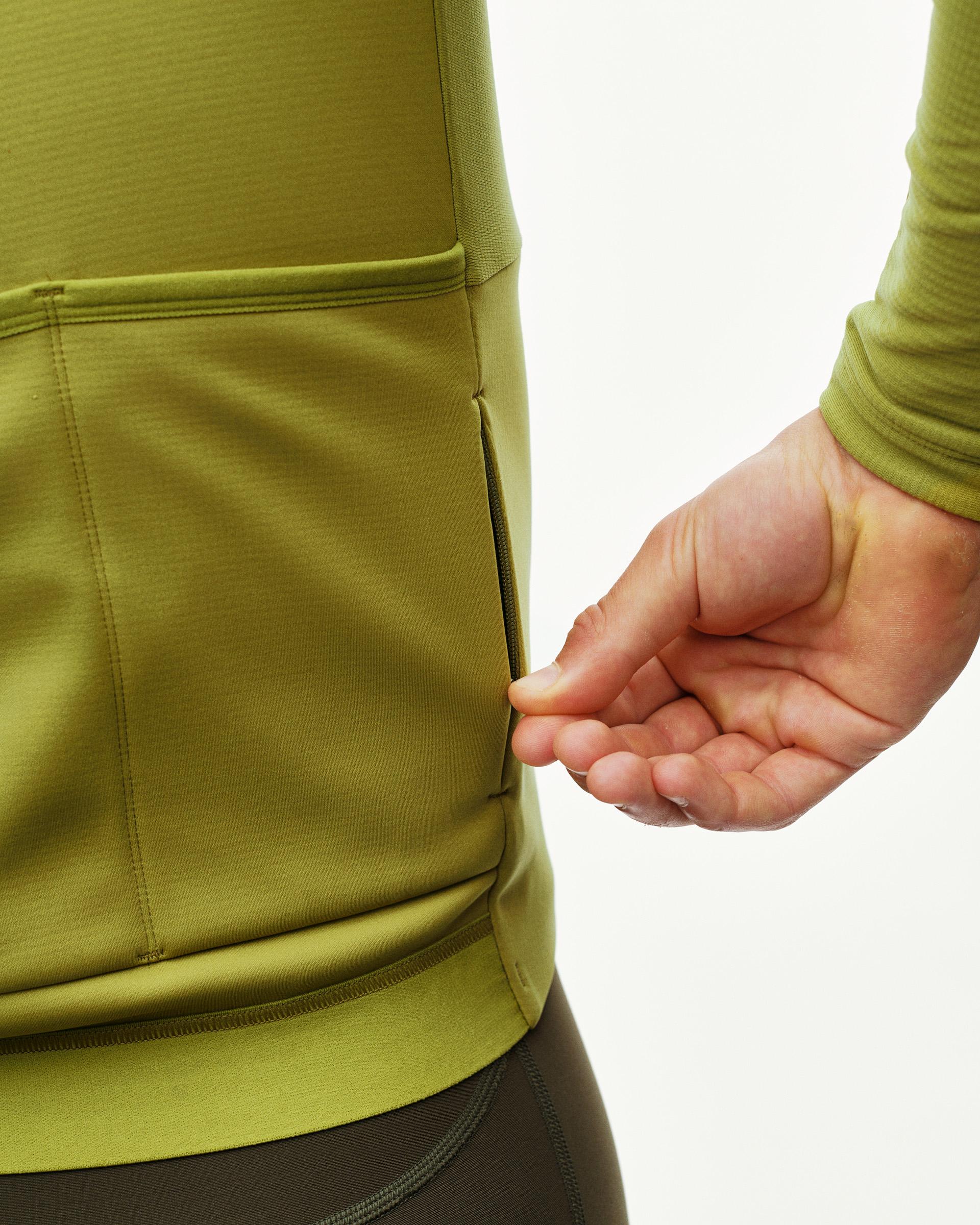 Dark Lime PAS Mechanism Thermal Long Sleeve cycling jersey, rear detail on model showing zipped pocket