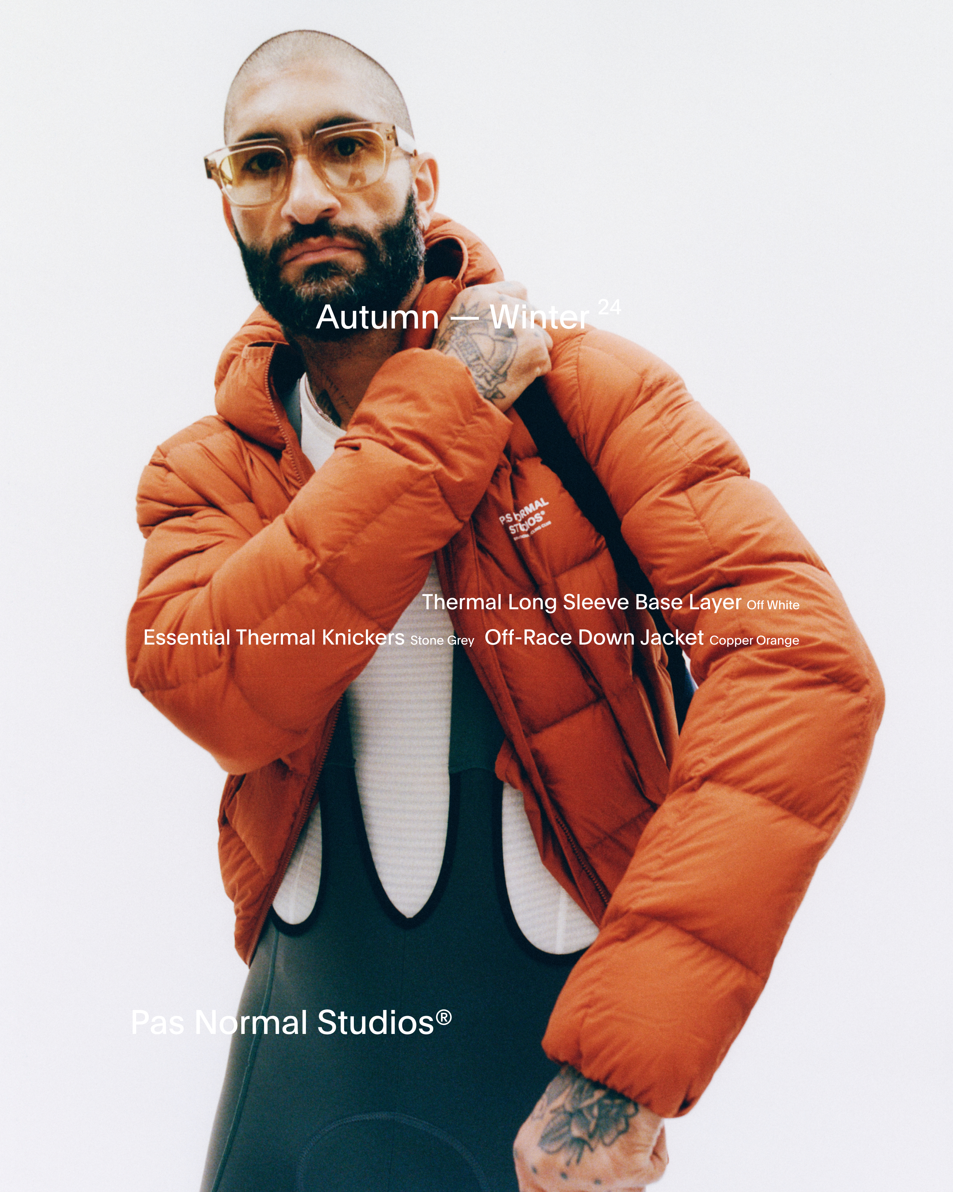 Model wearing copper orange Off-Race Down Jacket over white Thermal Long Sleeve Base Layer and grey Essential Thermal Knickers