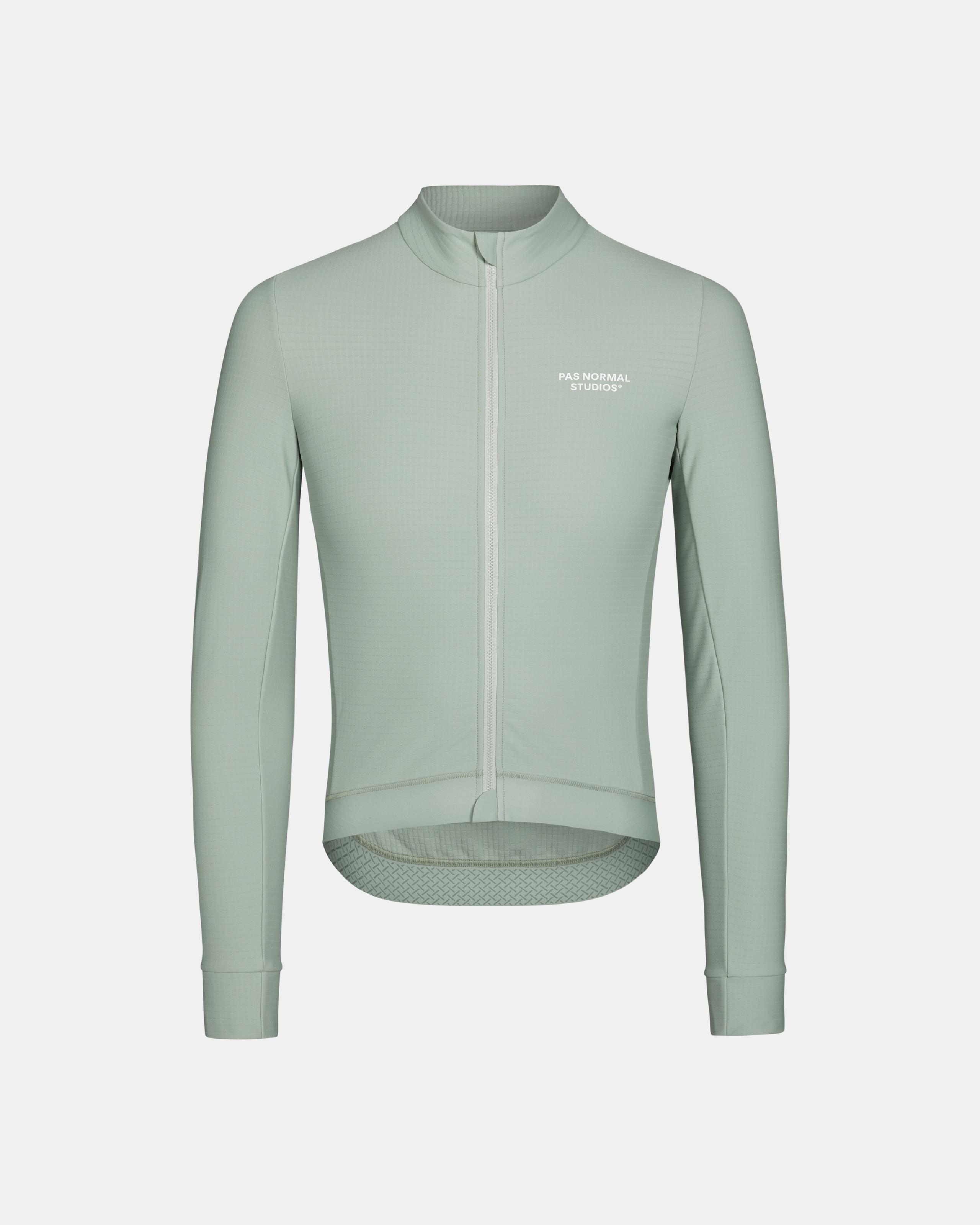 Green Essential long sleeve cycling jersey, front flat lay with white chest logo