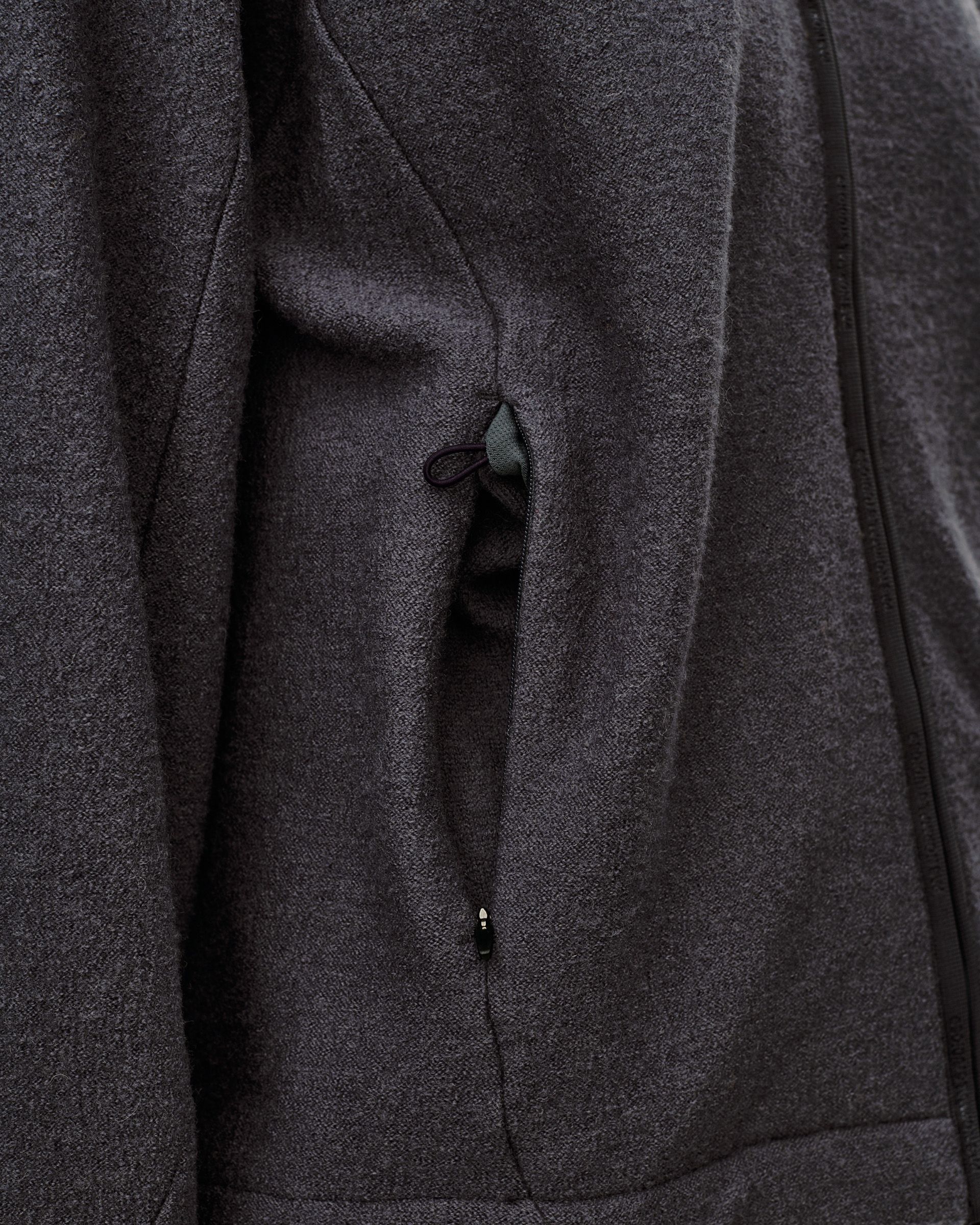 Dark Grey Off-Race Boiled Wool jacket, detail view of side zip pocket with green zip pull