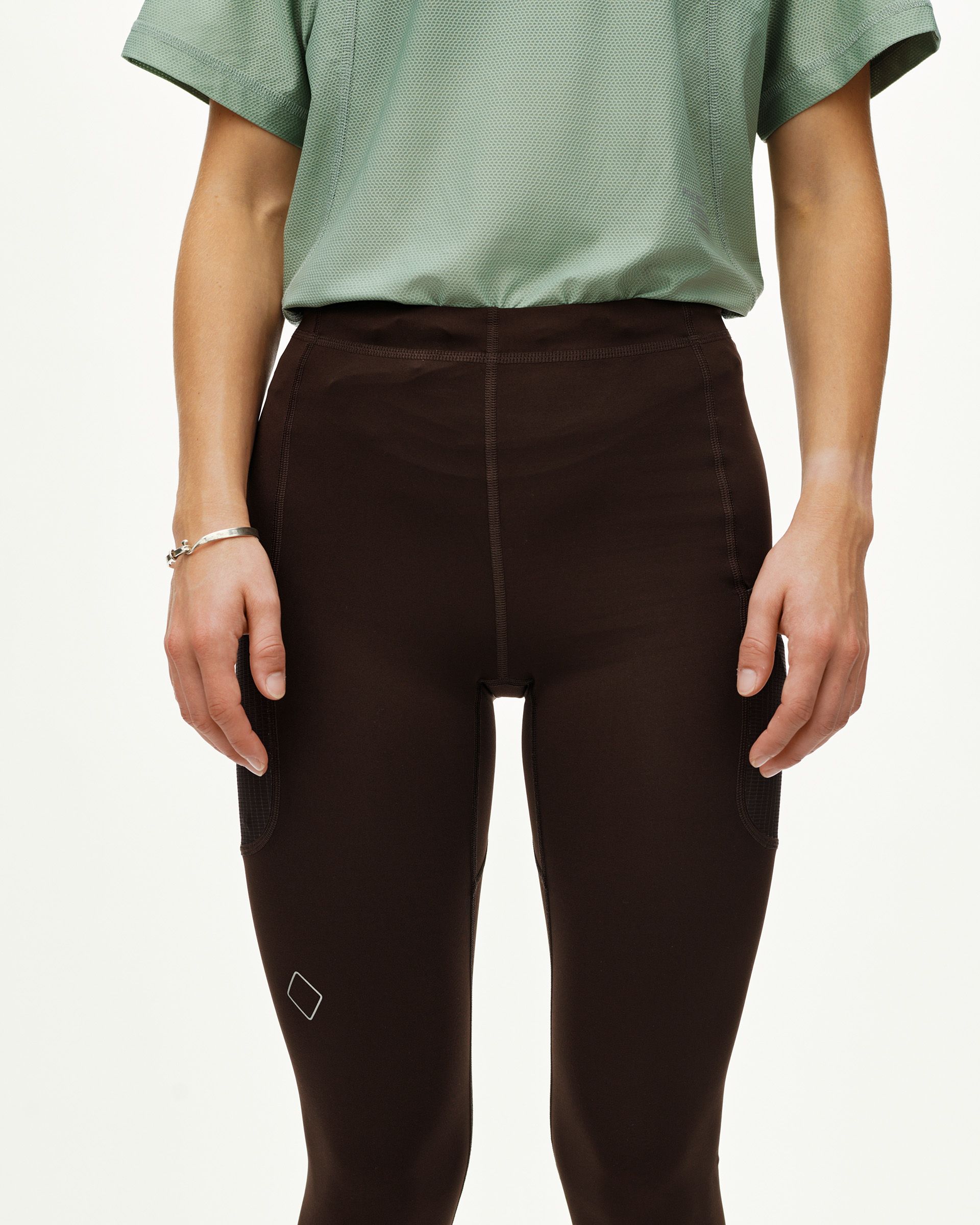 Dark Coffee Balance women's long cycling tights on model, front view with side mesh pockets