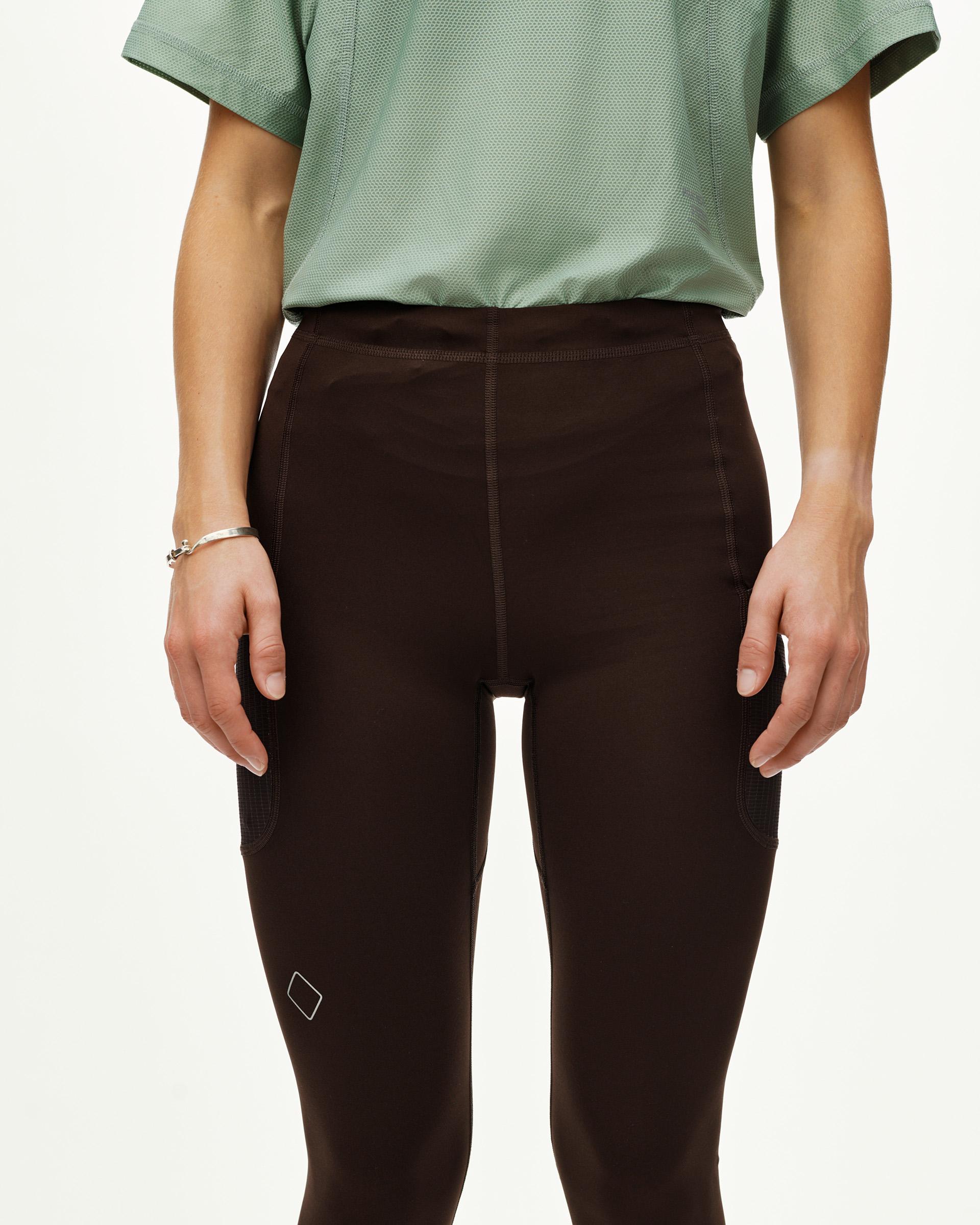 Dark Coffee Balance women's long cycling tights on model, front view with side mesh pockets