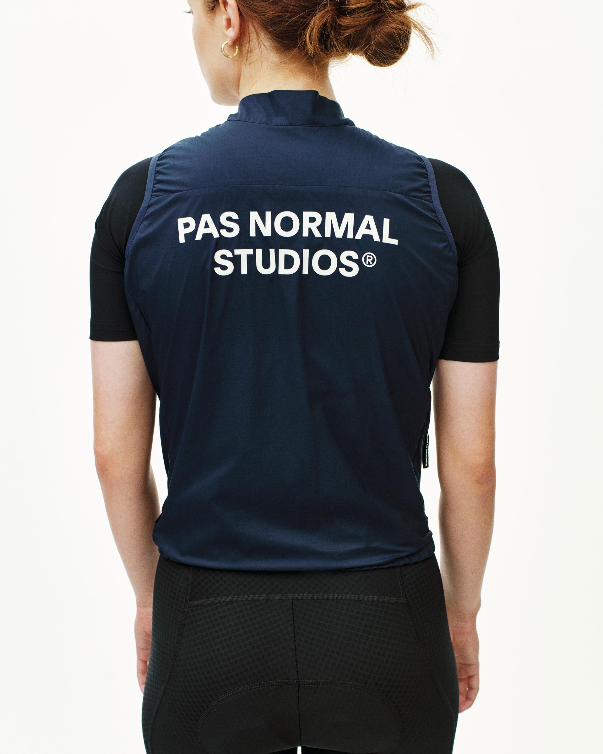 Navy Essential insulated gilet on model, rear view with white chest logo