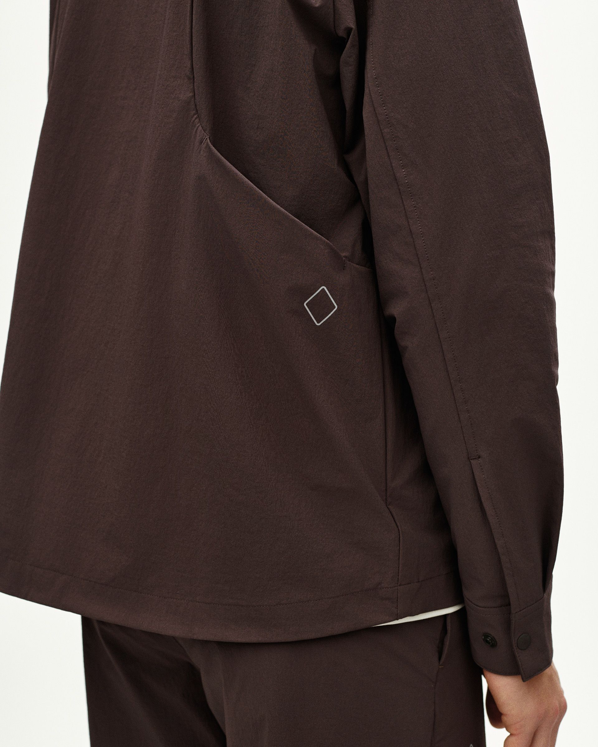 Dark Purple Off-Race Tech Overshirt, side detail view on model with white diamond logo