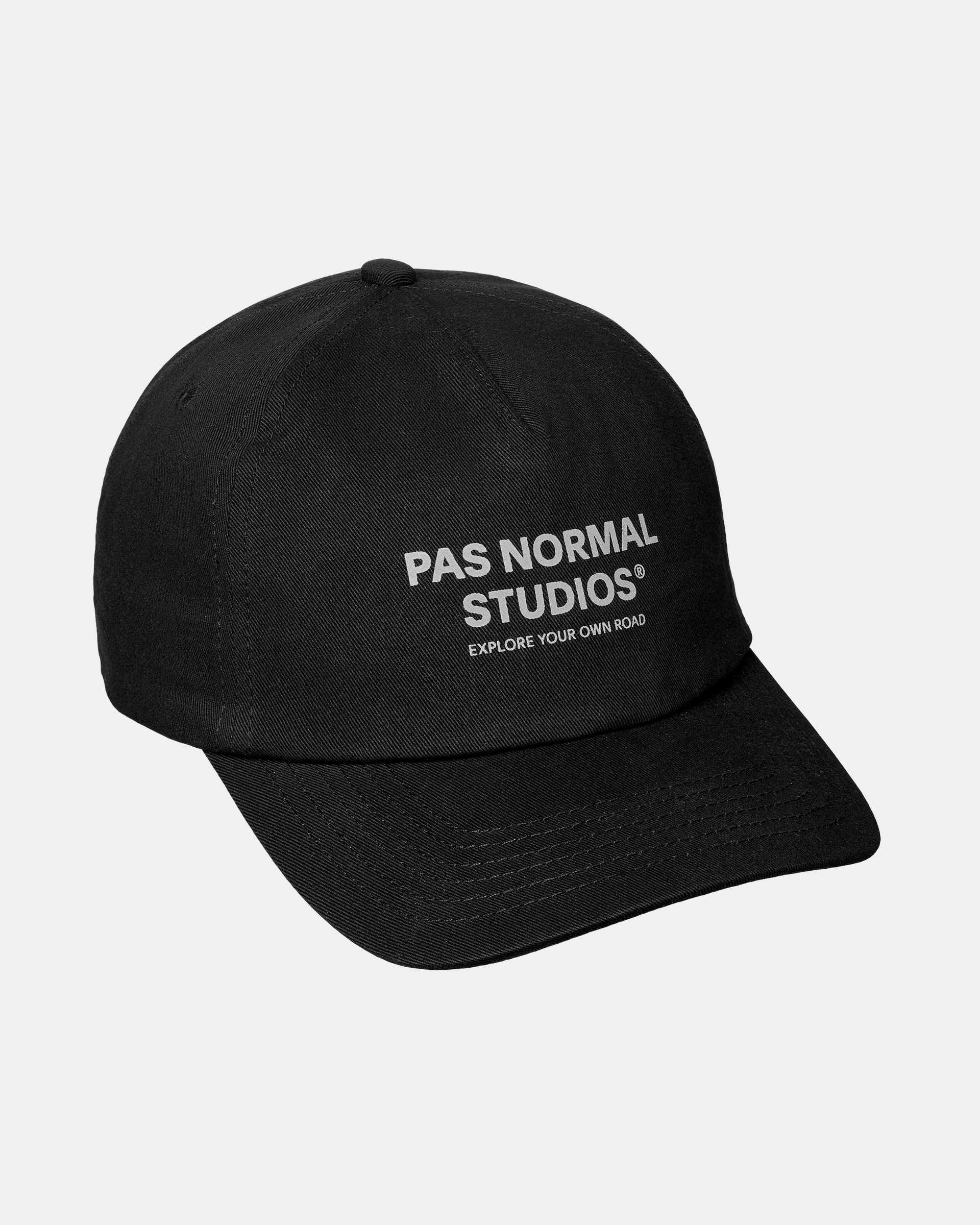 Black Off-Race Cotton Cap, three-quarter view with white brand text on front panel