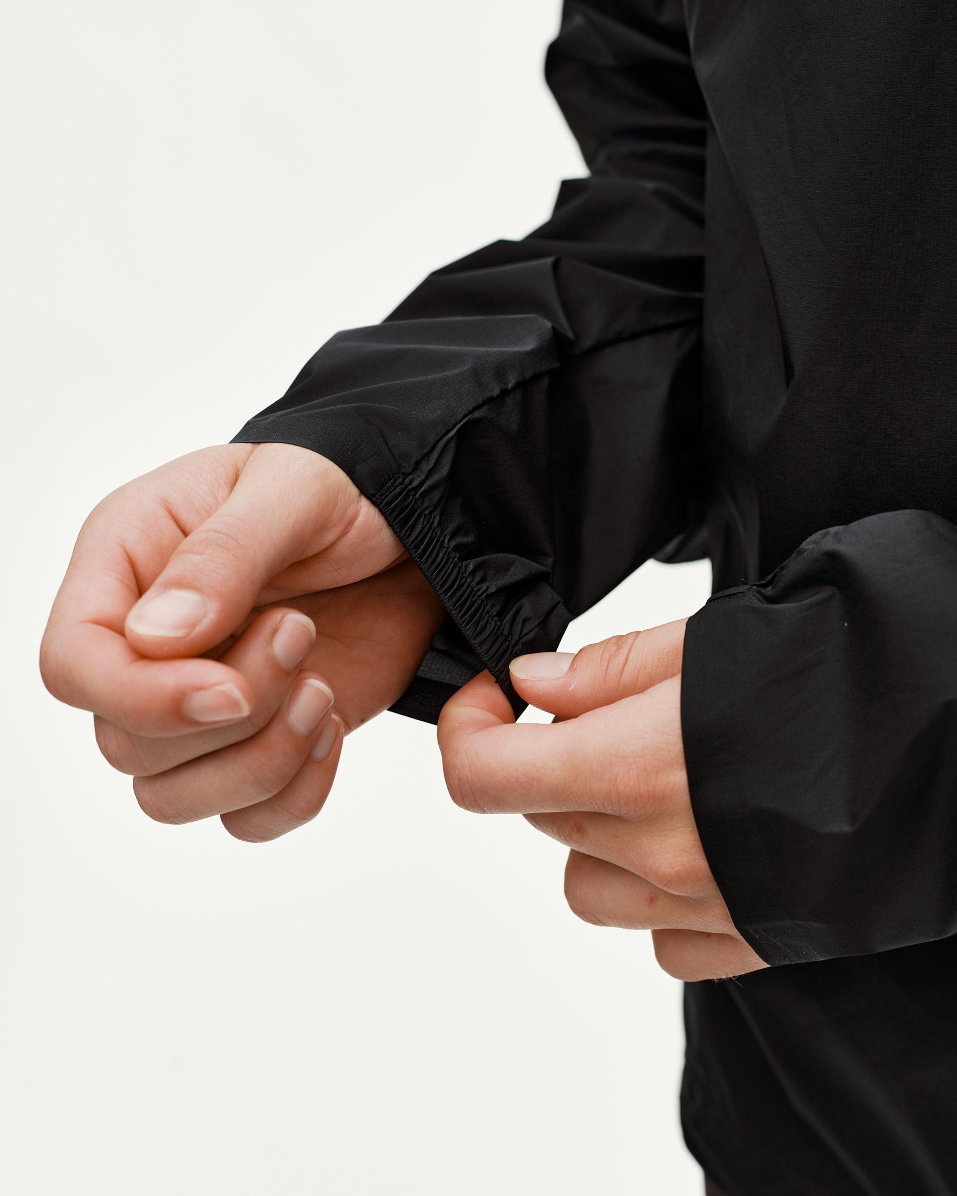 Black Balance Windproof jacket, sleeve detail on model with elasticated cuff
