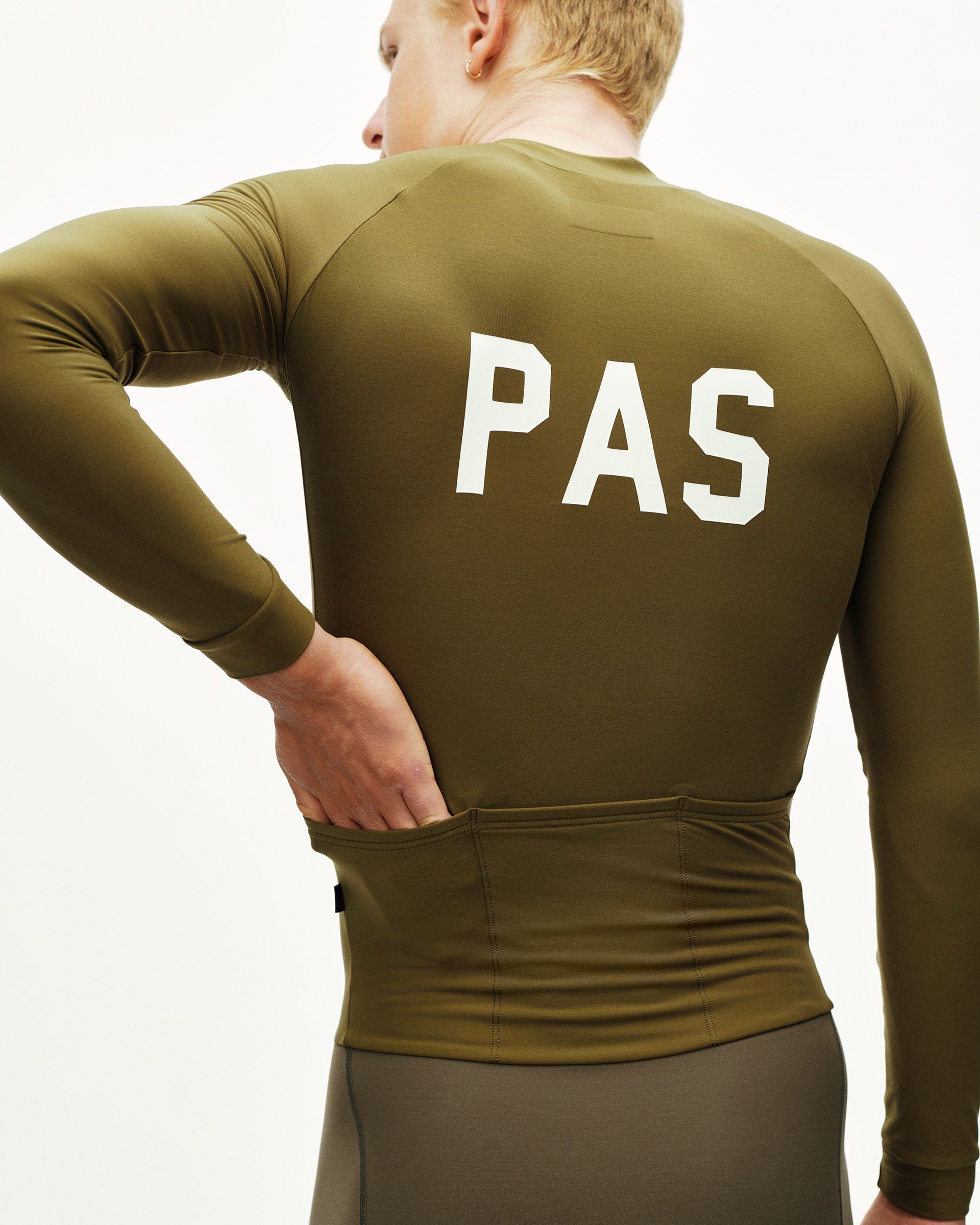 Moss Brown PAS cycling speedsuit on model, rear view with white PAS back print and rear pockets