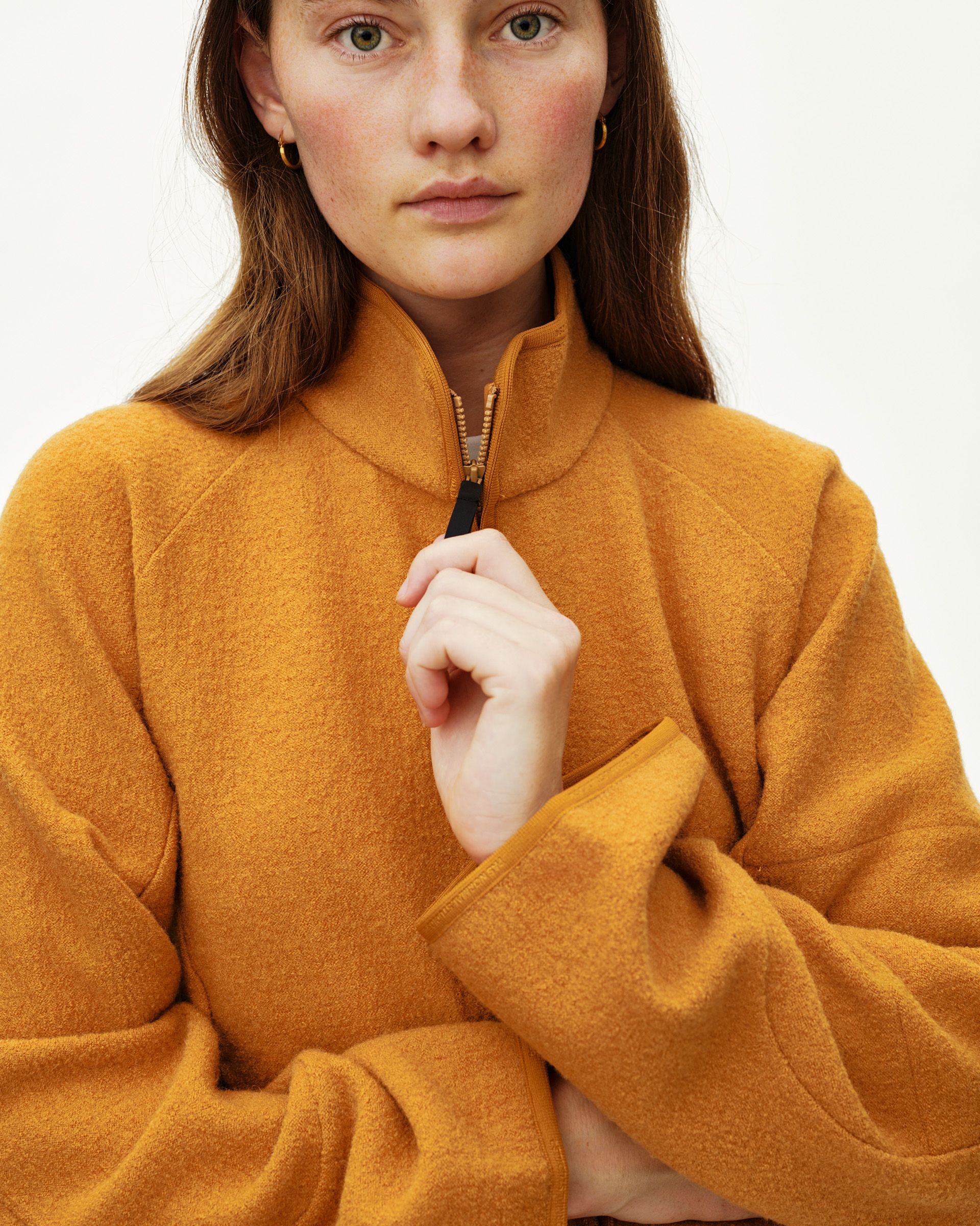 Ochre Off-Race Boiled Wool jacket on model, front detail view with half-zip collar