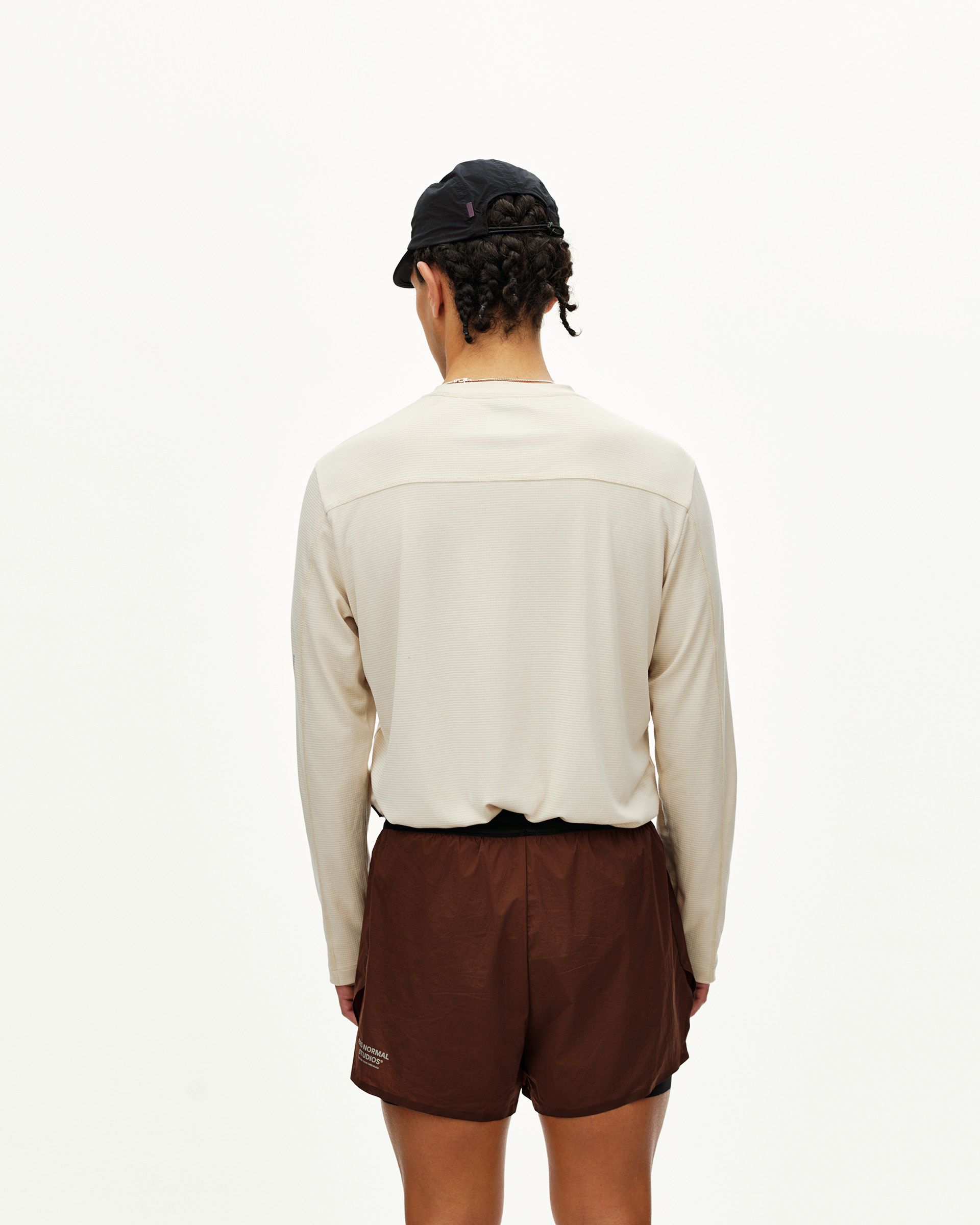 Maroon Brown Balance 2-in-1 shorts on model, rear view with contrast waistband