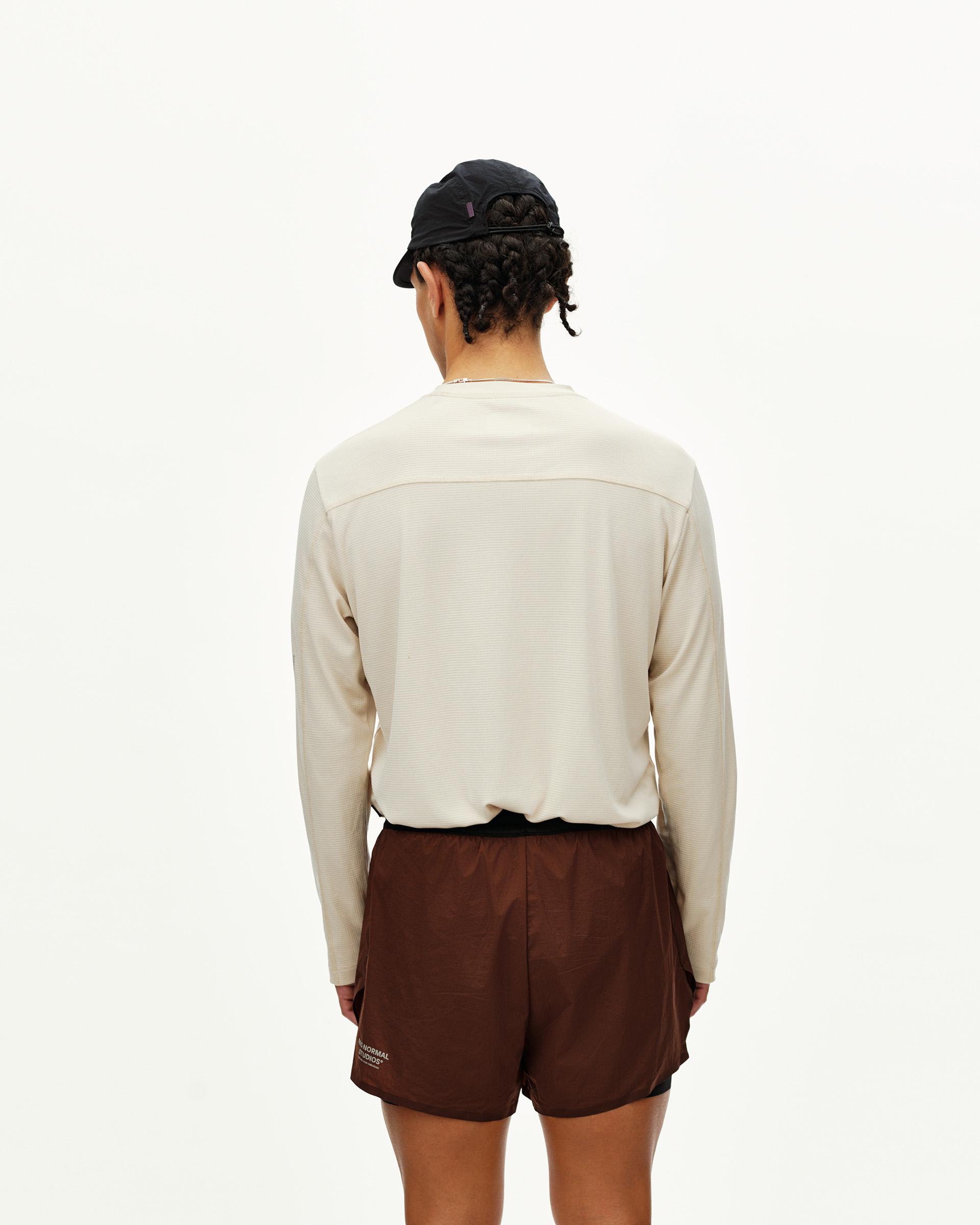 Maroon Brown Balance 2-in-1 shorts on model, rear view with contrast waistband