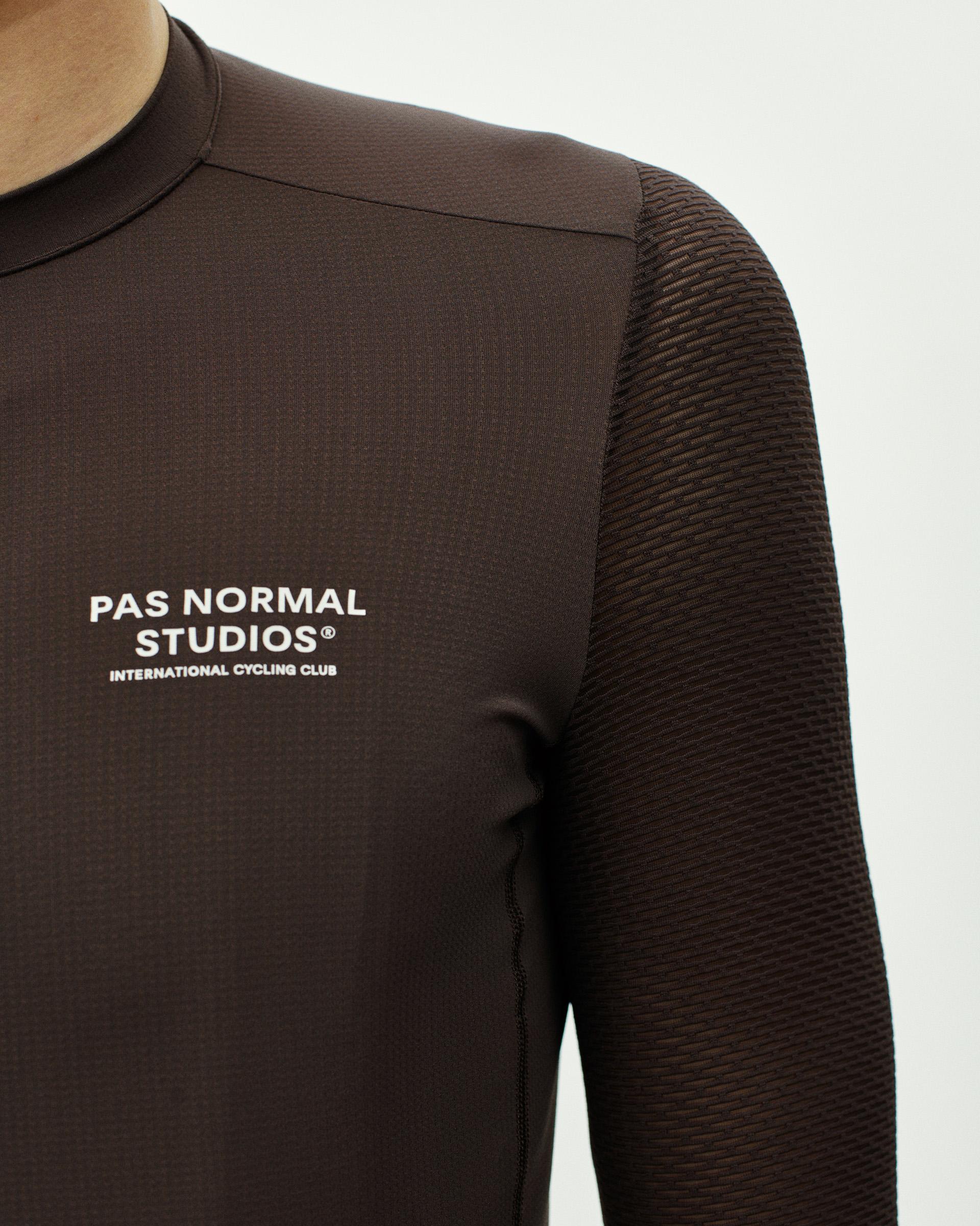 Dark Purple Essential Light long sleeve cycling jersey on model with textured sleeves