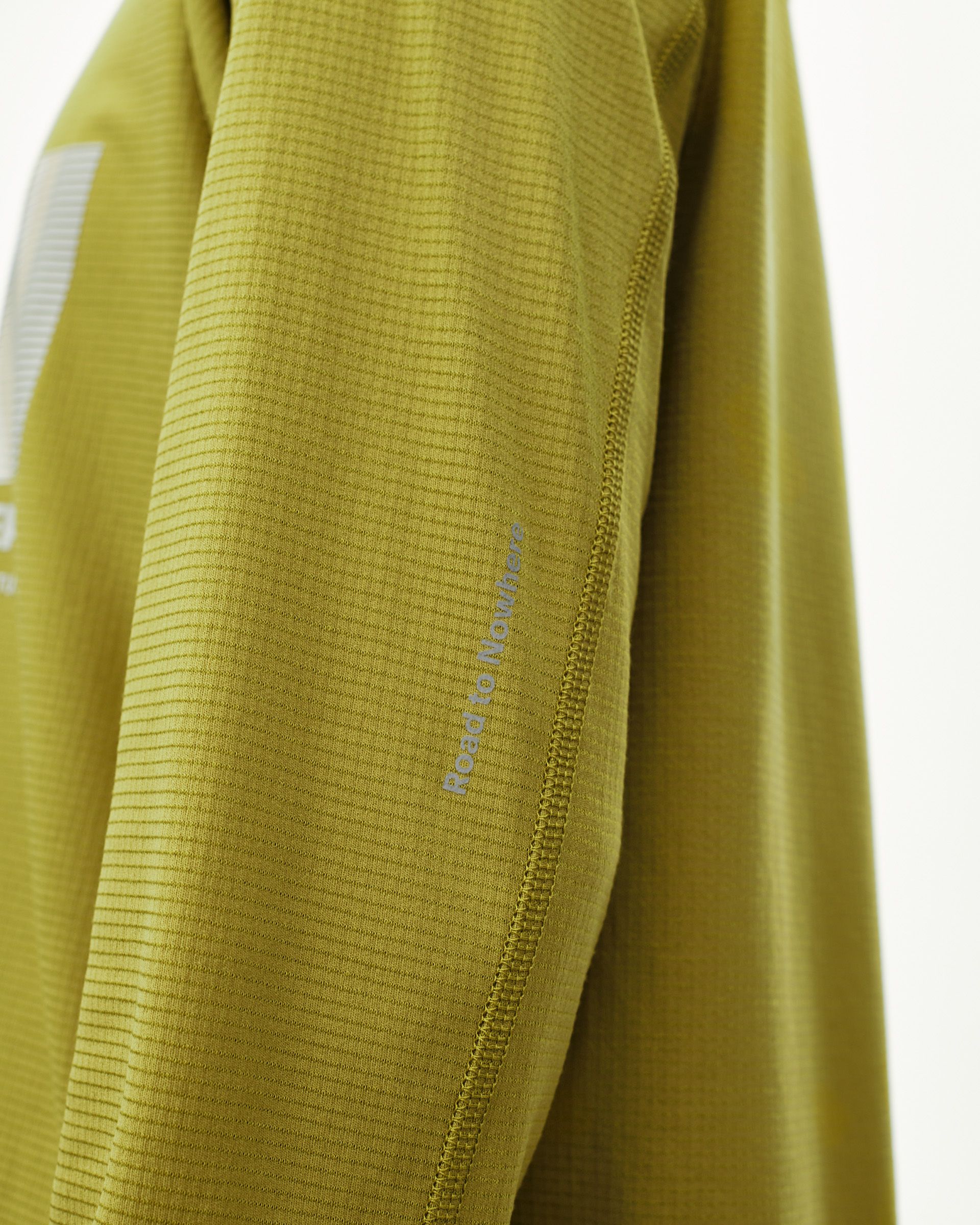 Dark Lime Balance long sleeve T-shirt, sleeve detail view with ribbed texture and contrast sleeve seam